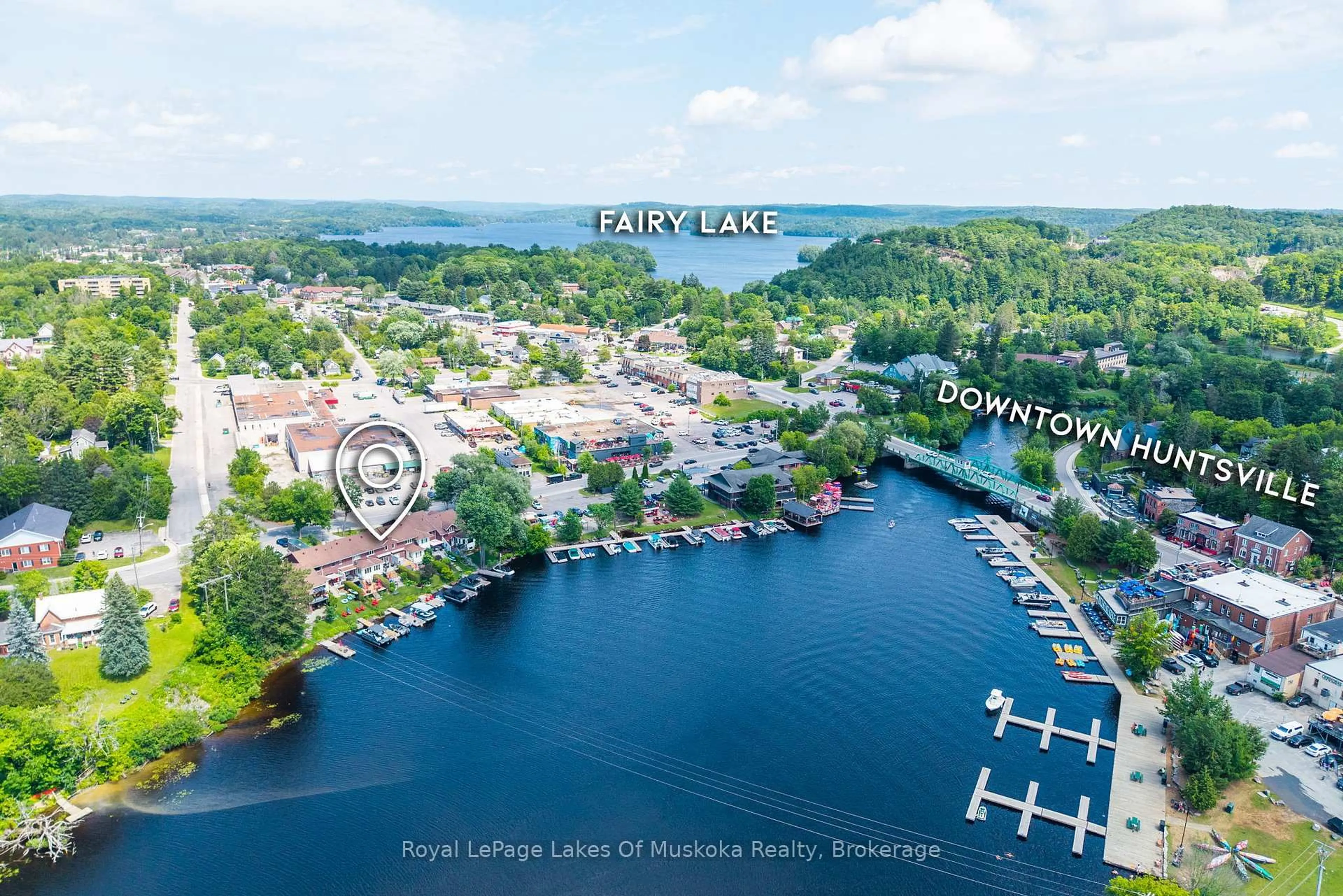 A pic from outside/outdoor area/front of a property/back of a property/a pic from drone, water/lake/river/ocean view for 21 John St, Huntsville Ontario P1H 1H2