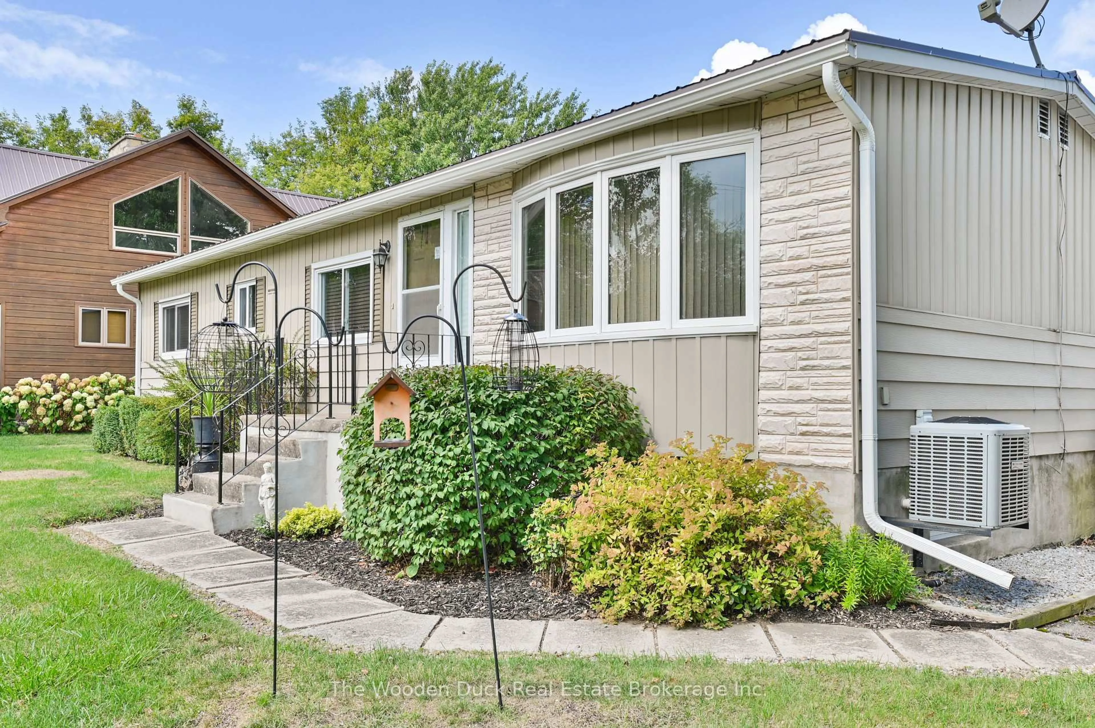Home with vinyl exterior material, street for 1314 County RD 96 Rd, Wolfe Island Ontario K0H 2Y0