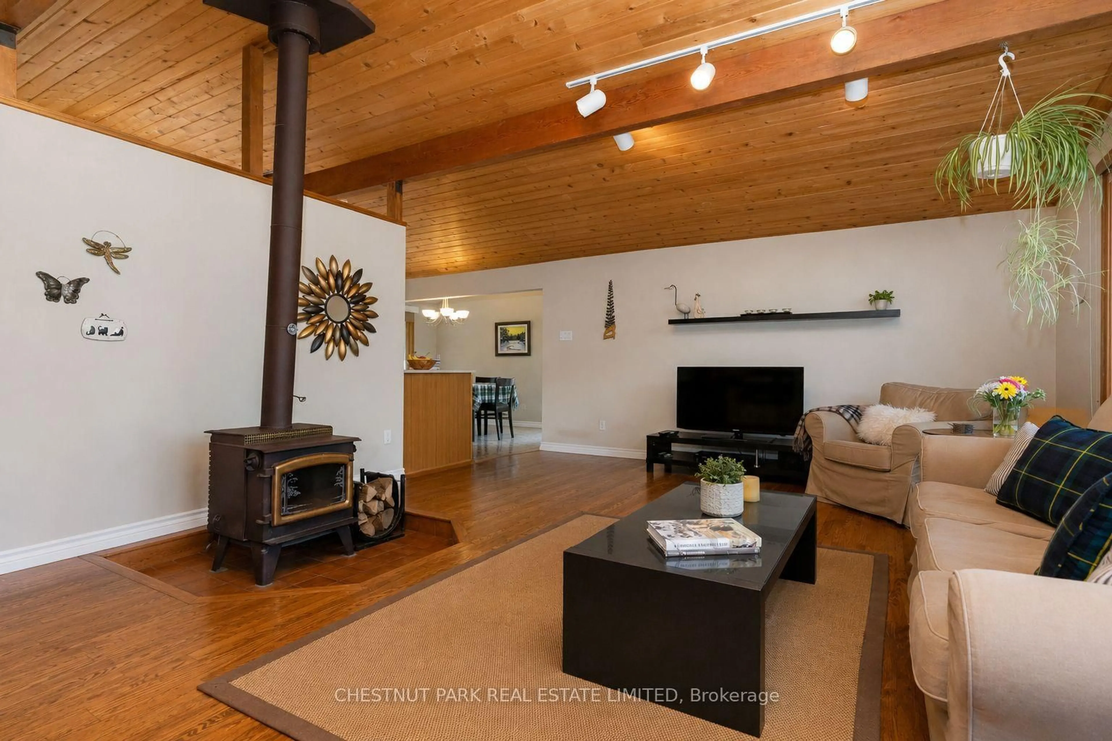 Living room with furniture, wood/laminate floor for 106545 10th Sdrd, Meaford Ontario N4L 1W7
