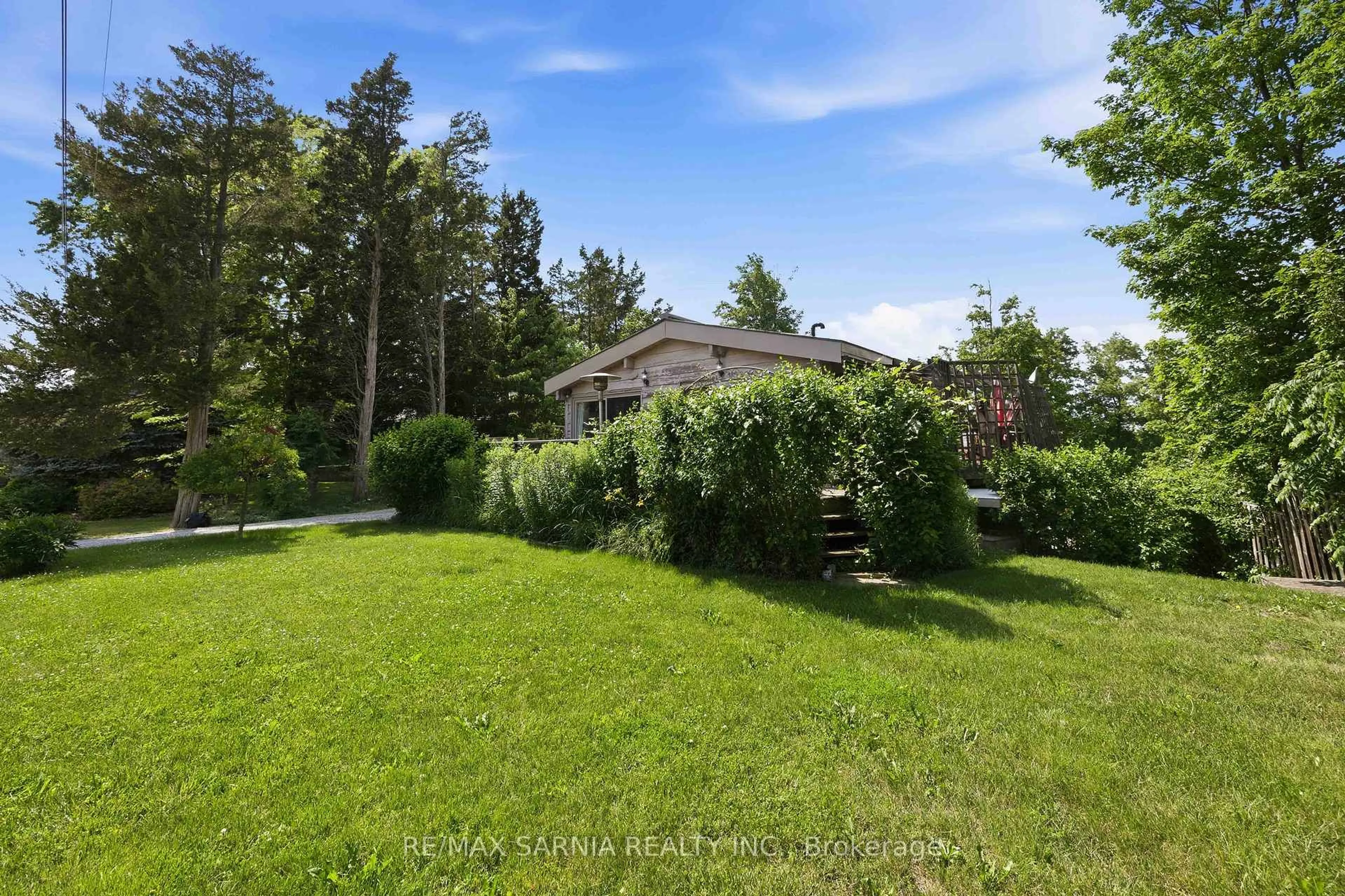 A pic from outside/outdoor area/front of a property/back of a property/a pic from drone, forest/trees view for 5496 Huron View Ave, Lambton Shores Ontario N0N 1J7