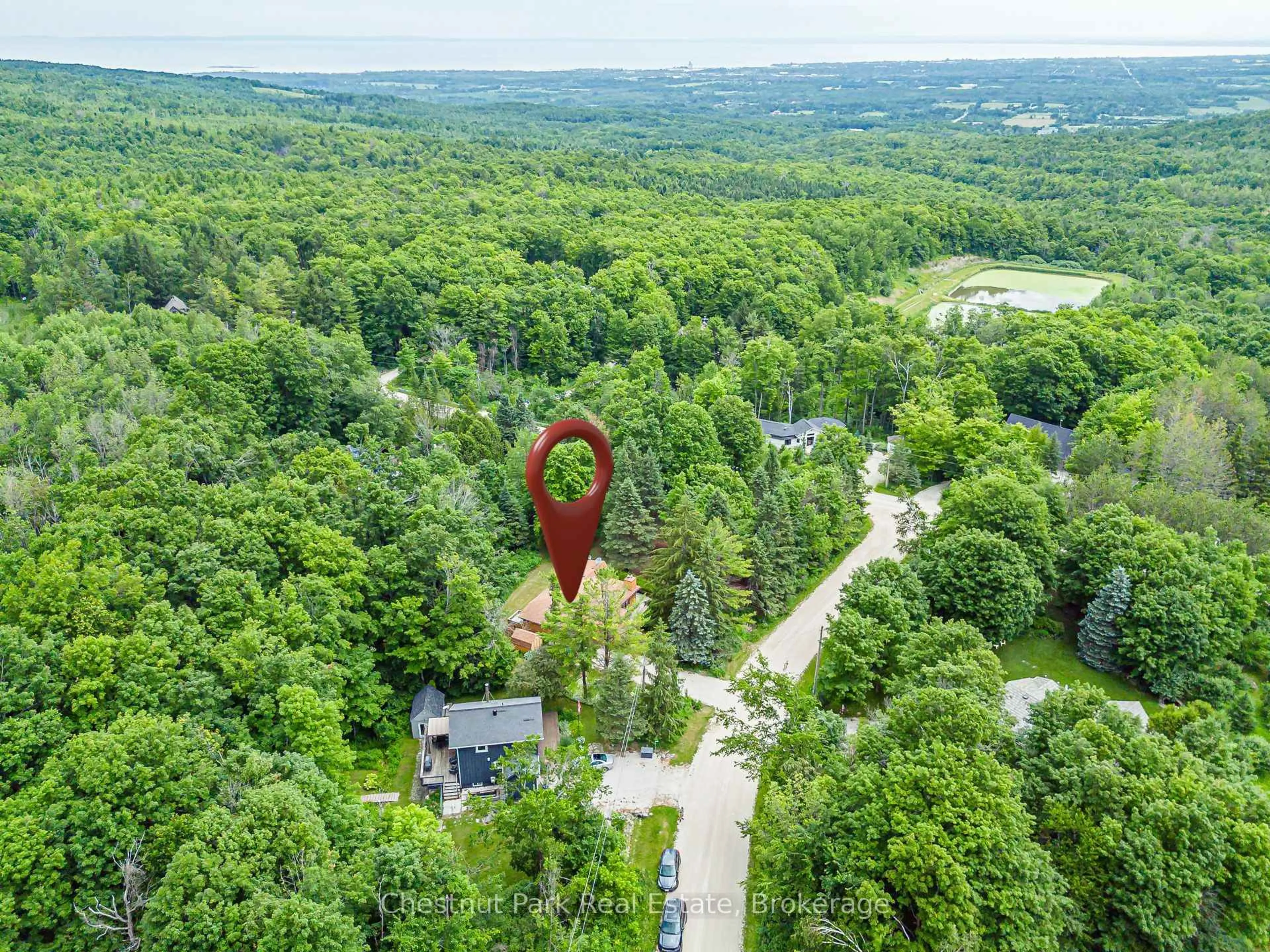 A pic from outside/outdoor area/front of a property/back of a property/a pic from drone, forest/trees view for 138 Kionontio Tr, Blue Mountains Ontario L9Y 0R6