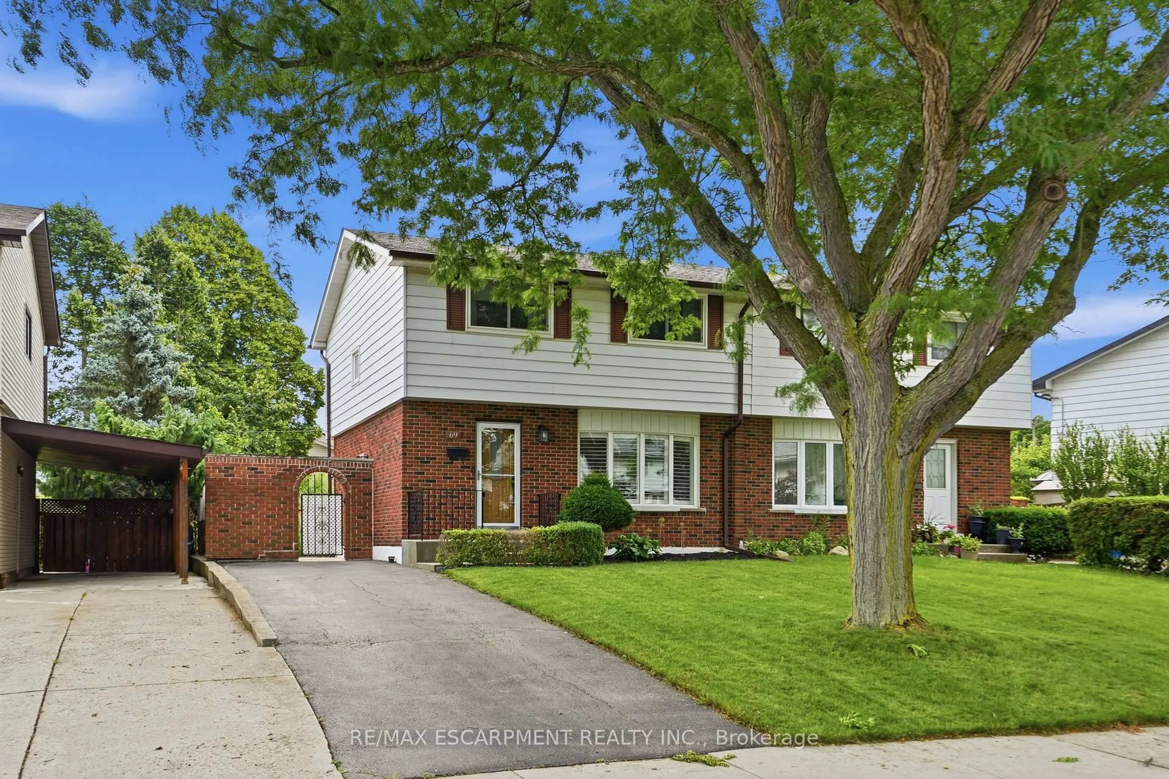 Home with brick exterior material, street for 69 Fairway Dr, Hamilton Ontario L8K 5L6