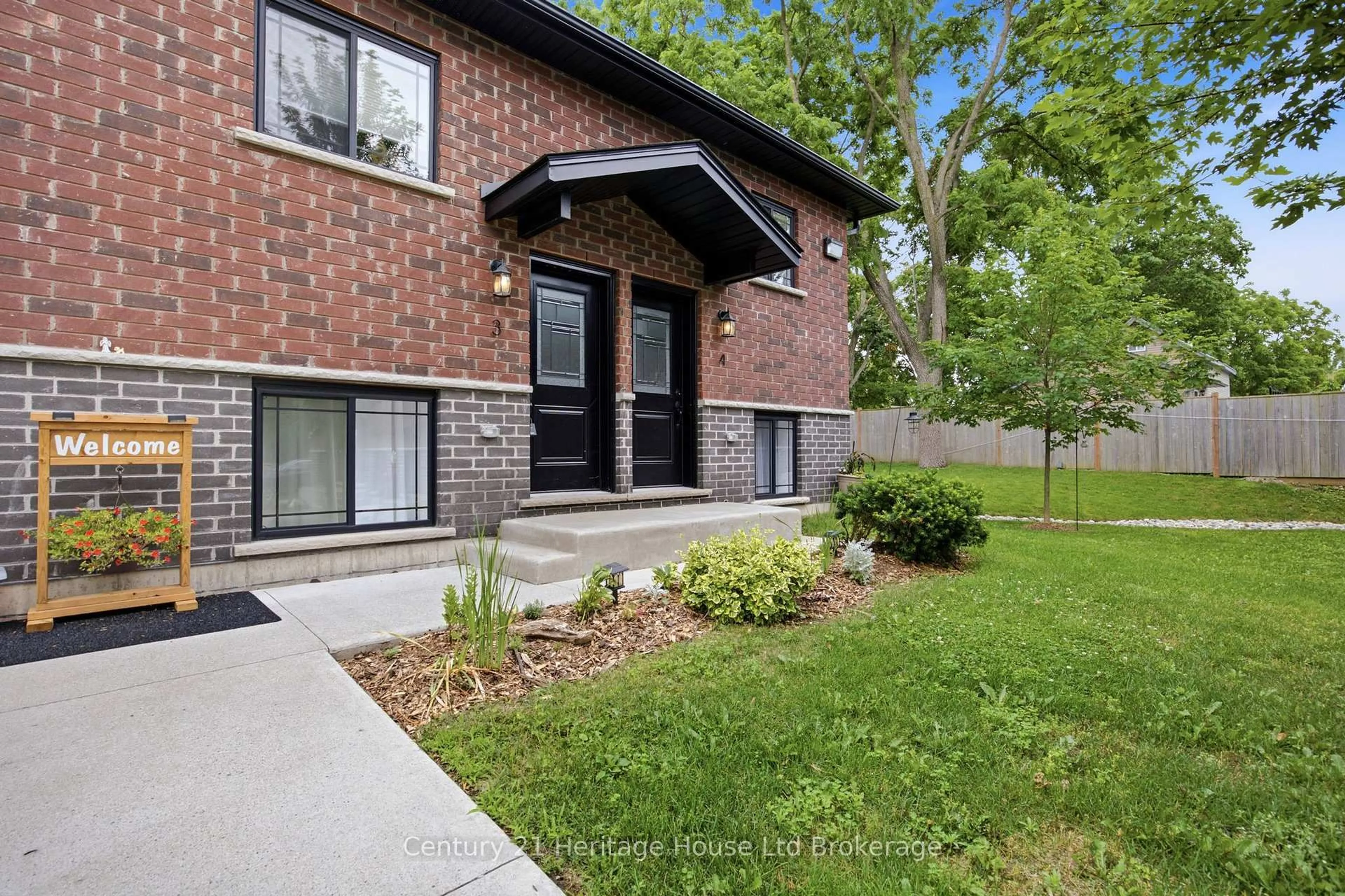 Home with brick exterior material, street for 34 Bain St #4, Woodstock Ontario N4S 5X8