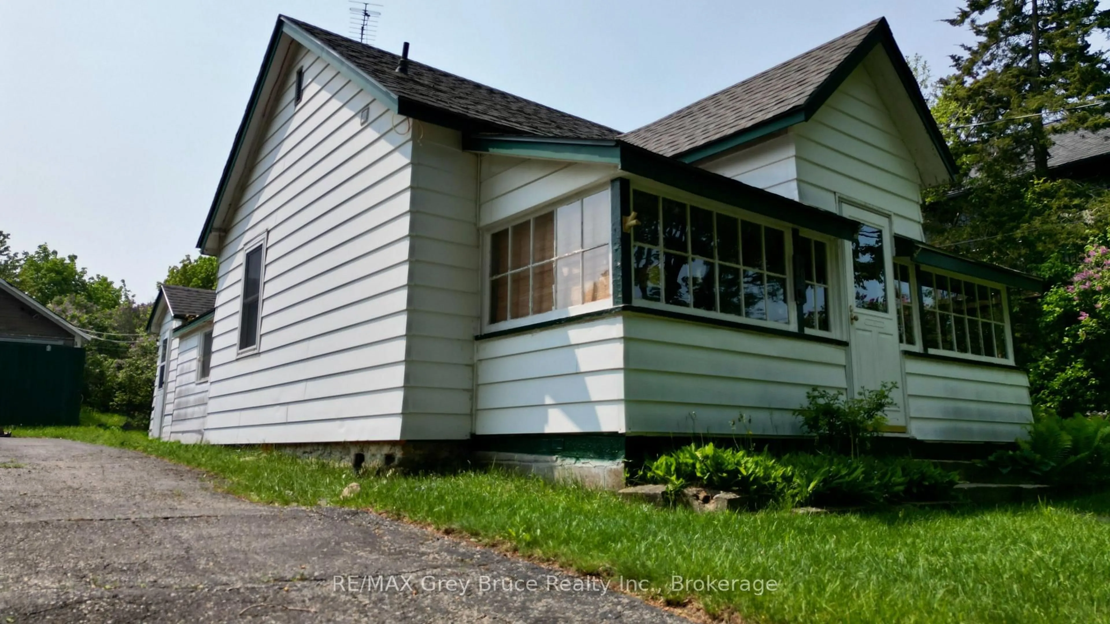 Home with vinyl exterior material, street for 19 Mill St, Northern Bruce Peninsula Ontario N0H 1W0