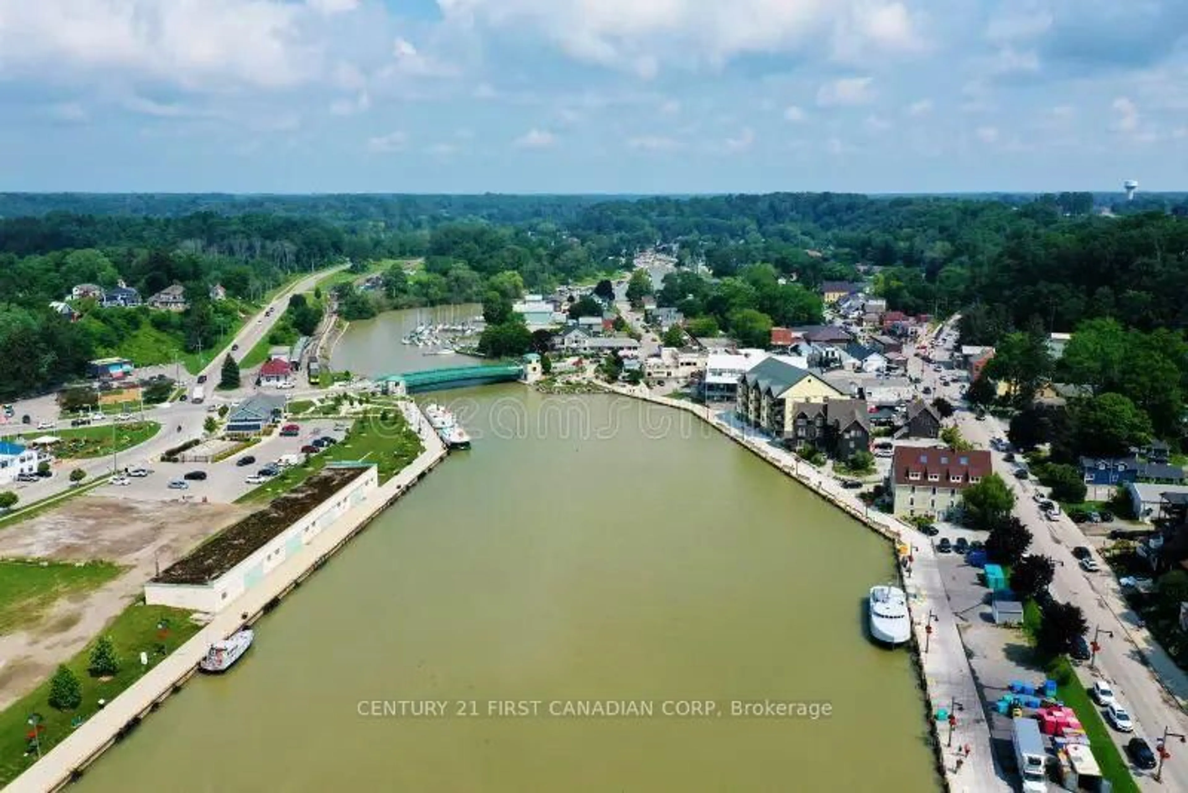 A pic from outside/outdoor area/front of a property/back of a property/a pic from drone, water/lake/river/ocean view for 205 Orchard St, Central Elgin Ontario N5L 1C4