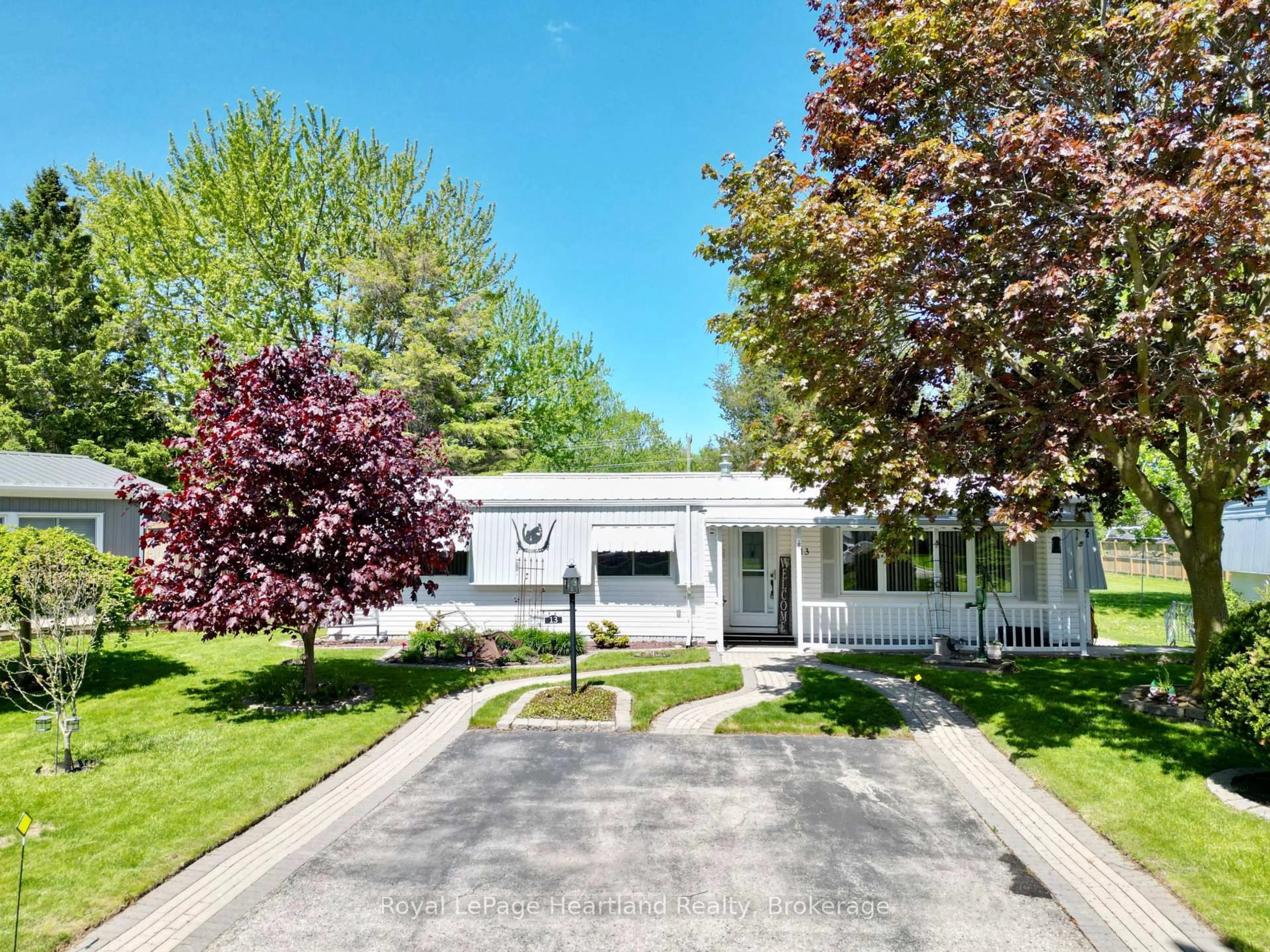 Home with vinyl exterior material, street for 13 Cypress Point Cres, South Huron Ontario N0M 1T0