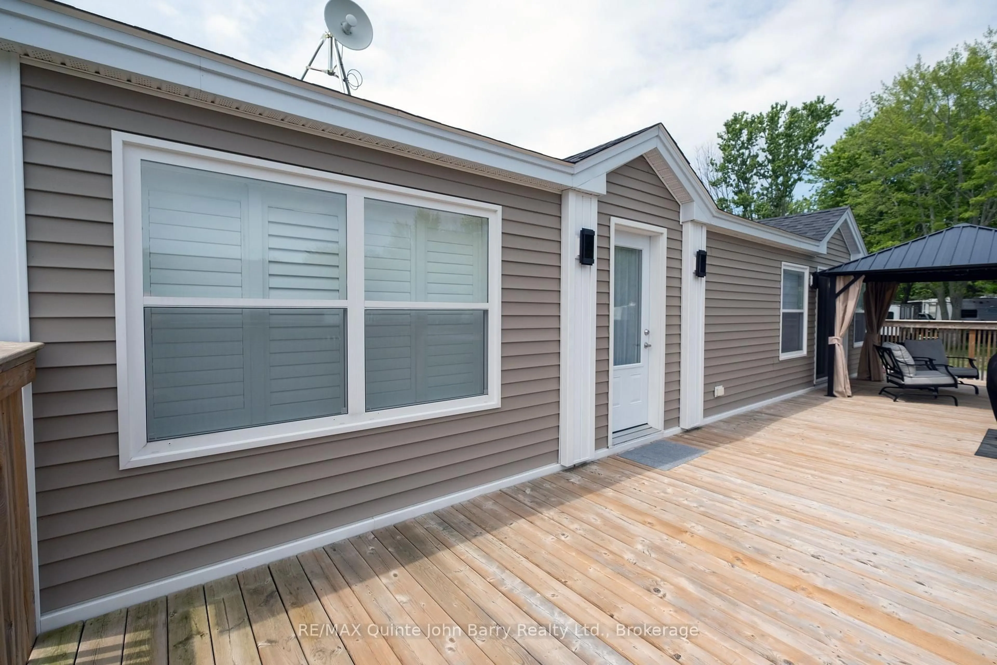 Home with vinyl exterior material, street for 153 County Rd 27 #H22, Prince Edward County Ontario K0K 1T0