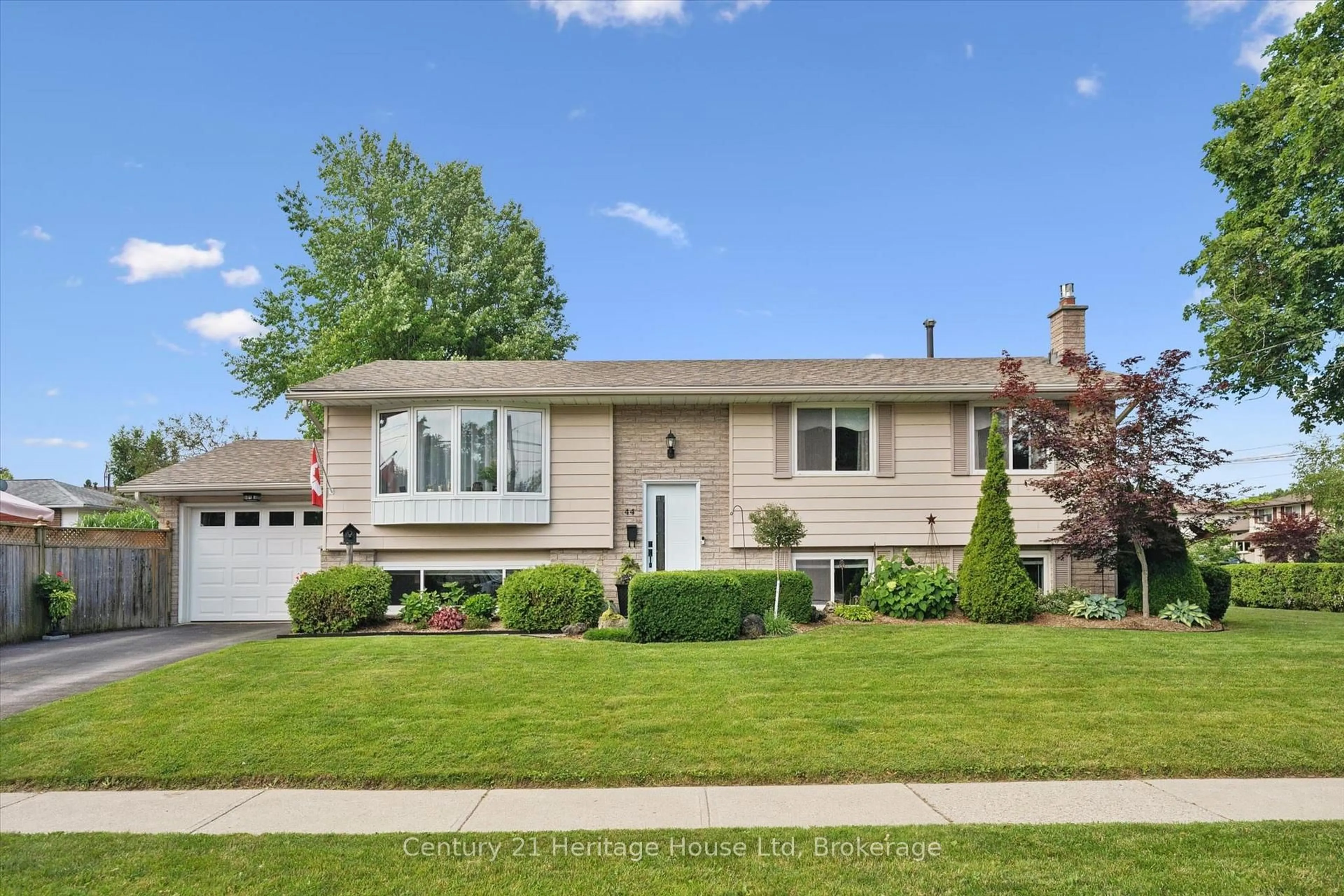 Home with vinyl exterior material, street for 44 Inverness Dr, Guelph Ontario N1E 6K3