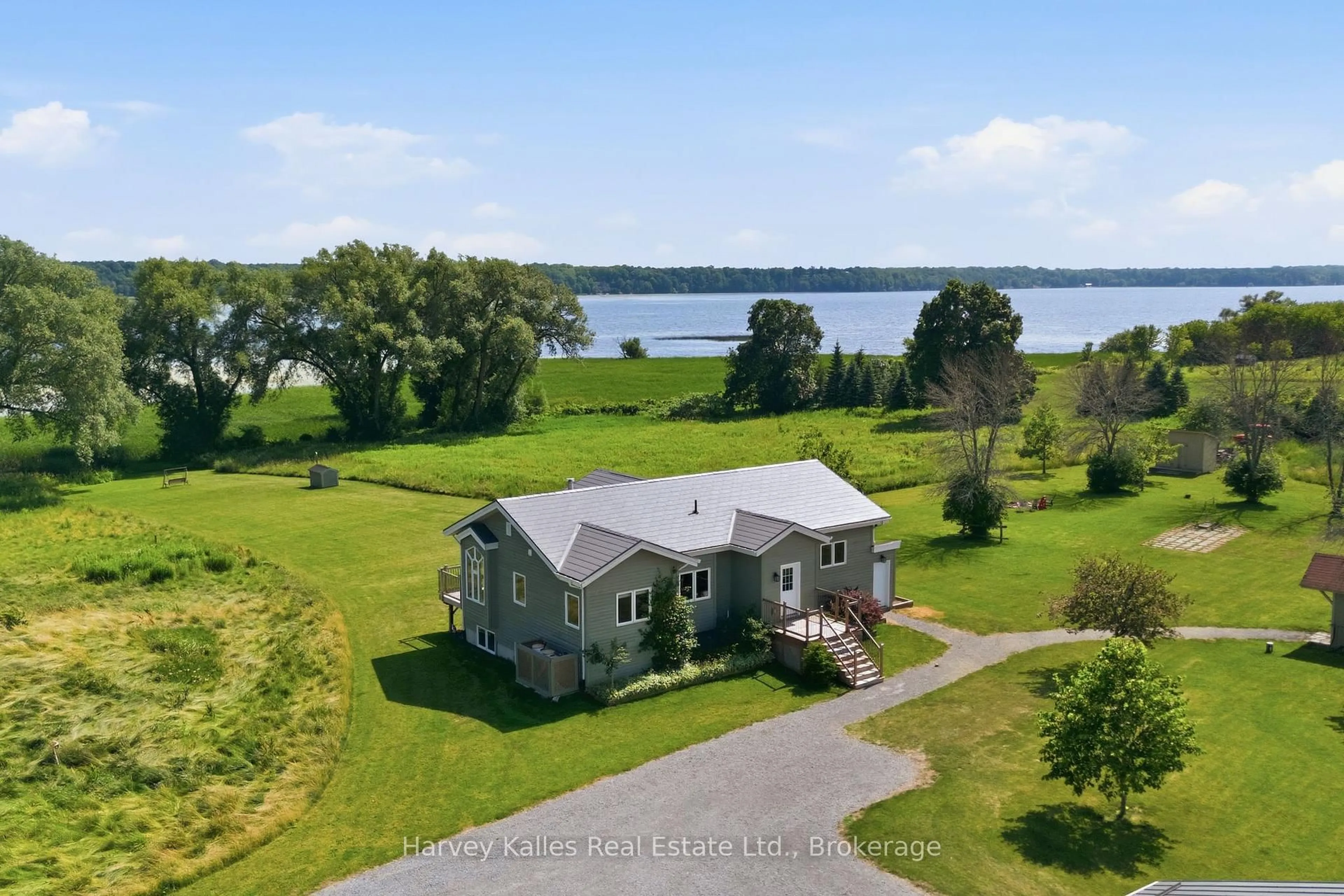 A pic from outside/outdoor area/front of a property/back of a property/a pic from drone, water/lake/river/ocean view for 388 South Big Island Rd, Prince Edward County Ontario K0K 1W0