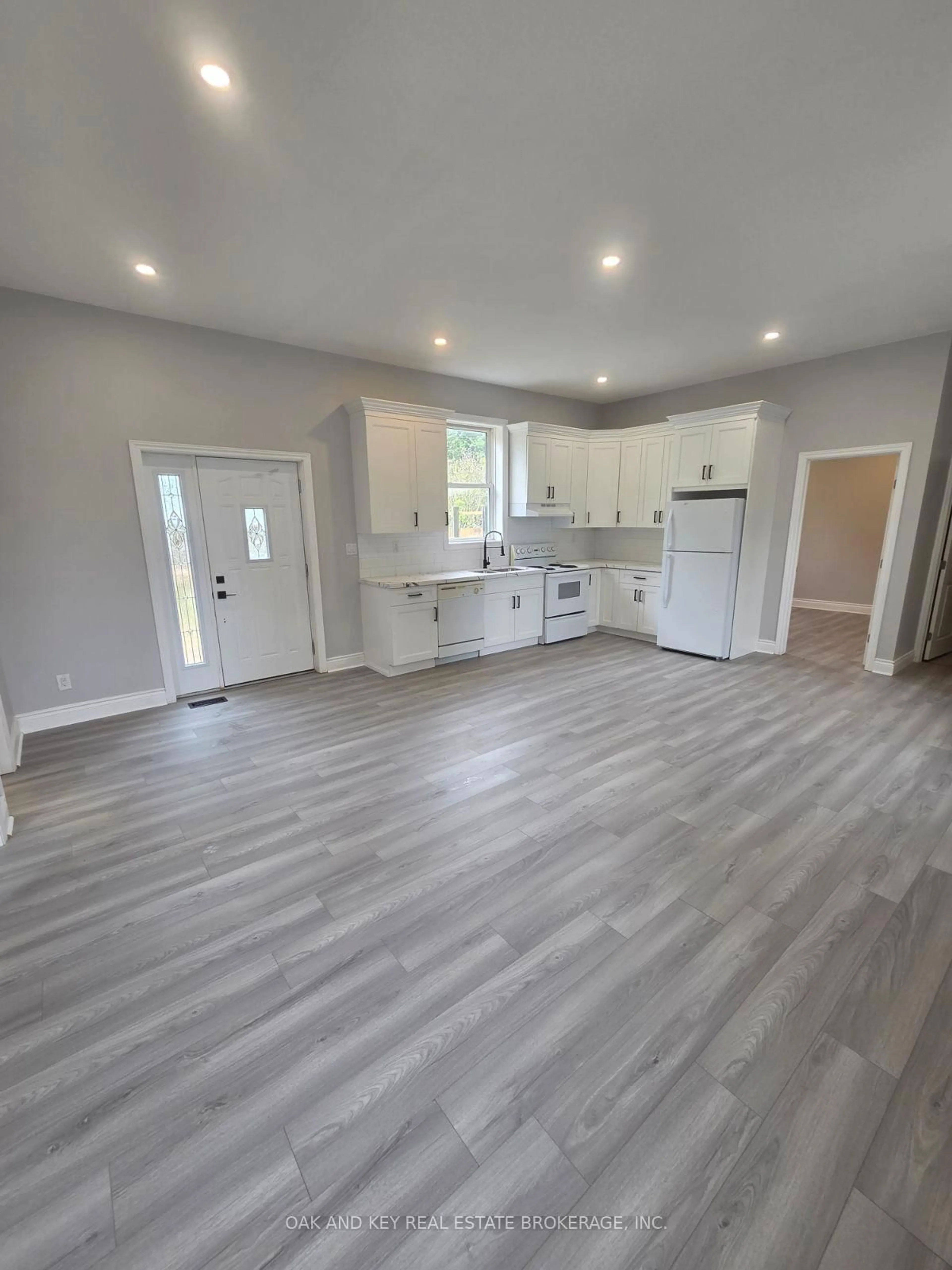 Open concept kitchen, wood/laminate floor for 22933 Hagerty Rd, Newbury Ontario N0L 1Z0