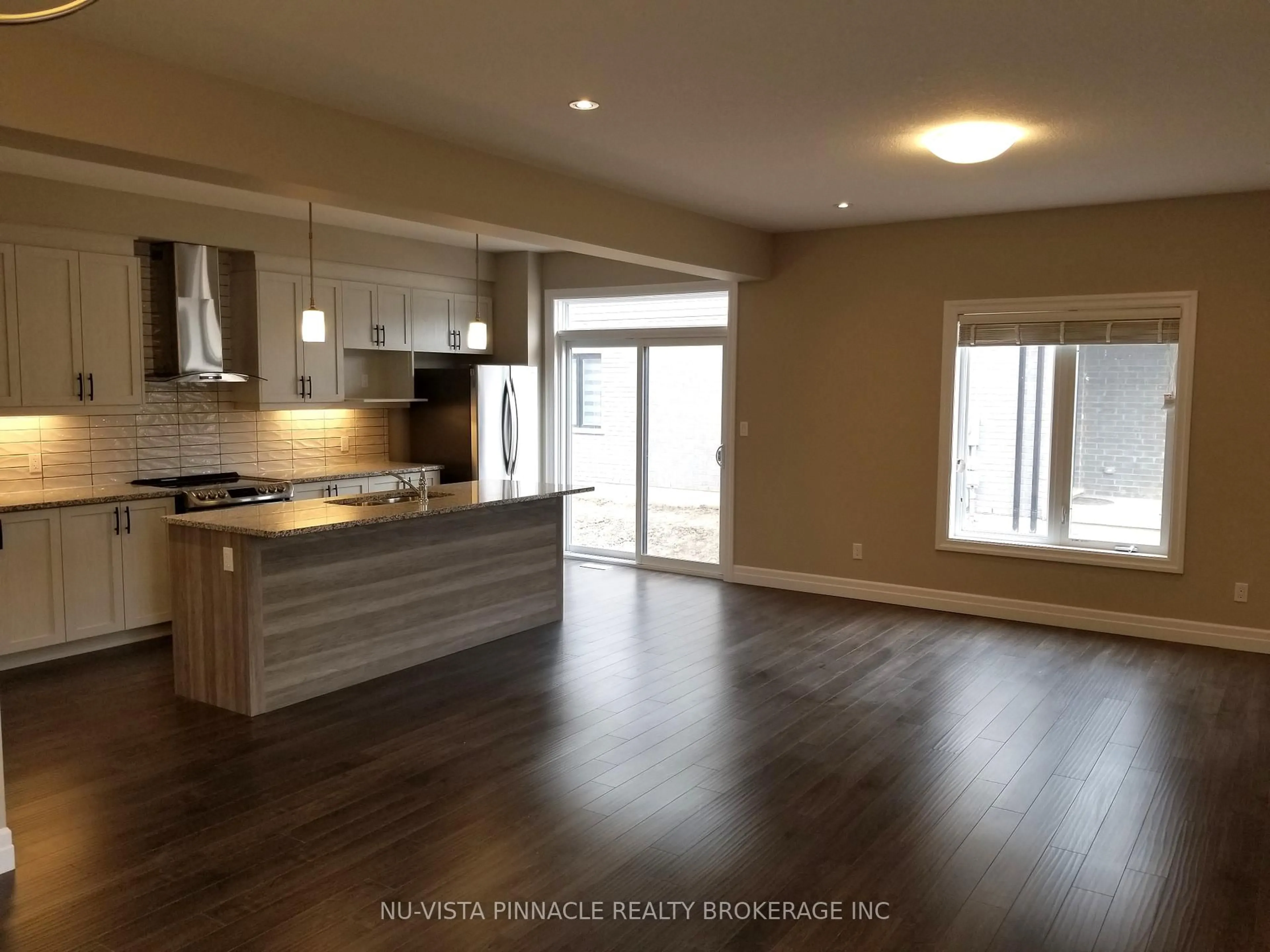 Open concept kitchen, wood/laminate floor for 3074 Turner Cres, London South Ontario N6M 0B2