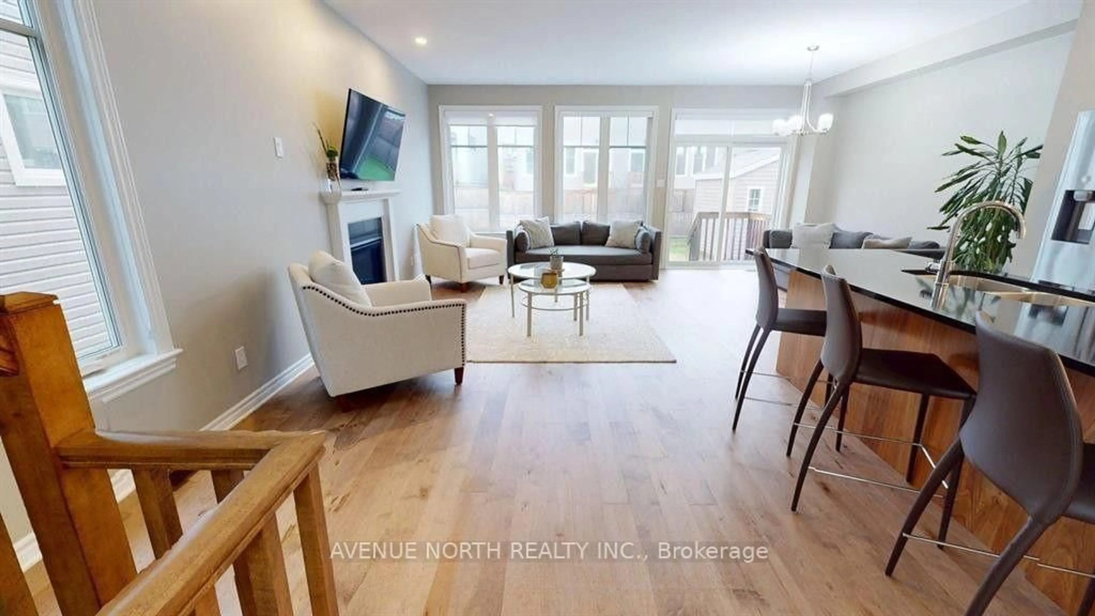 Living room with furniture, wood/laminate floor for 881 Antonio Farley St, Orleans Ontario K4A 5K1