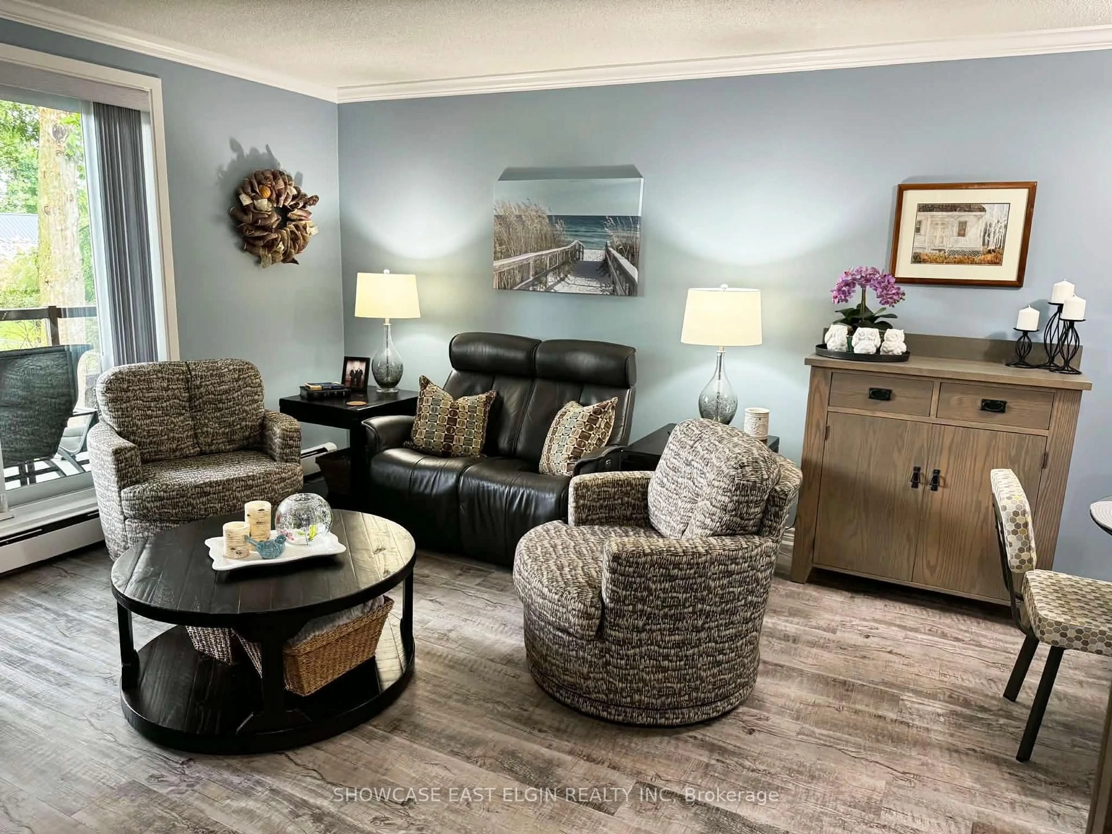 Living room with furniture, wood/laminate floor for 91 Spruce St #201, Aylmer Ontario N5H 1B4