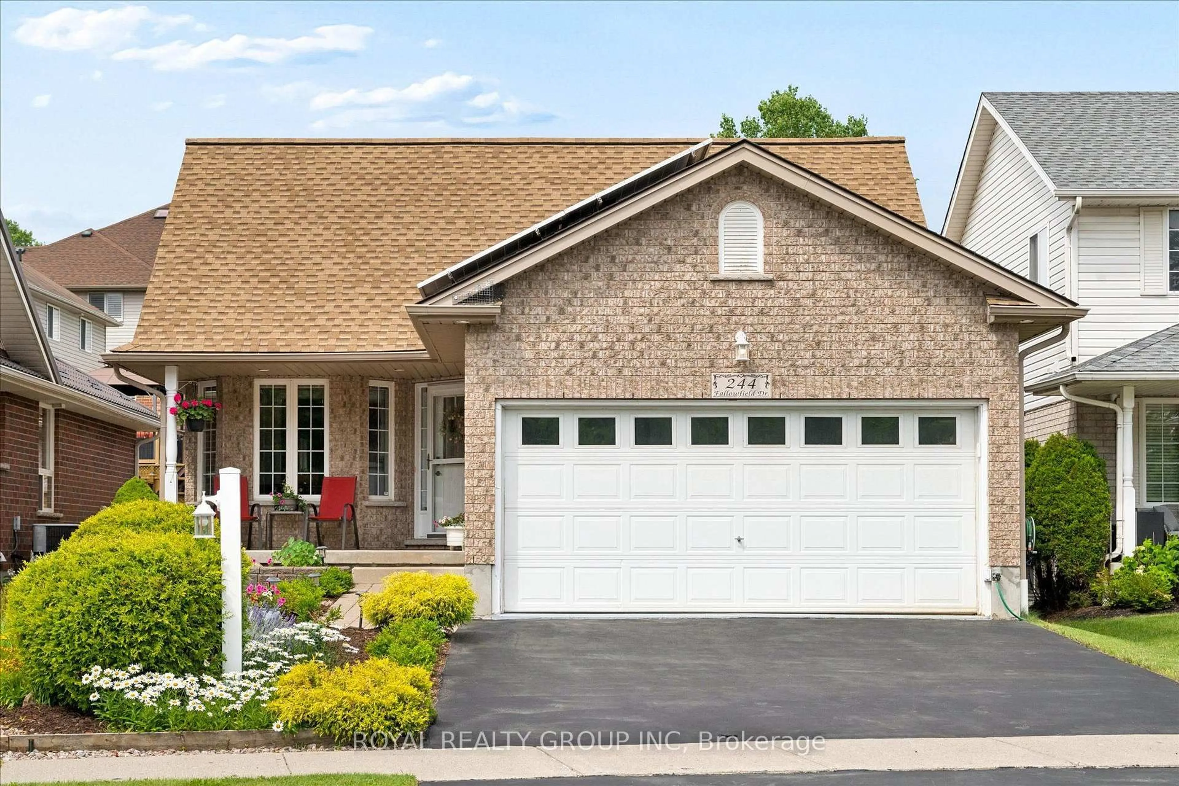 Home with brick exterior material, street for 244 Fallowfield Dr, Kitchener Ontario N2C 2T7