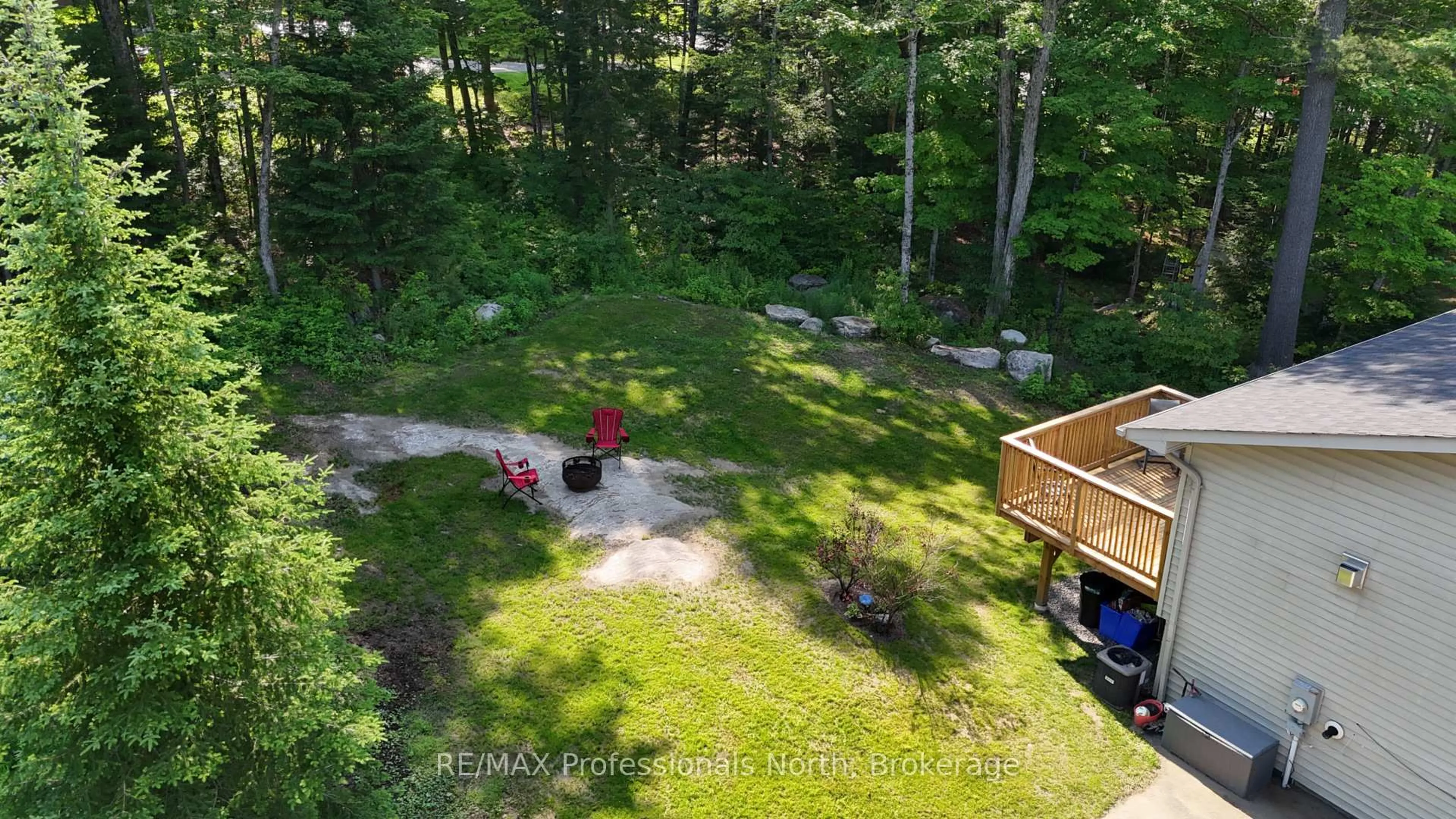 A pic from outside/outdoor area/front of a property/back of a property/a pic from drone, forest/trees view for 1036 Post Rd, Bracebridge Ontario P1L 1W9