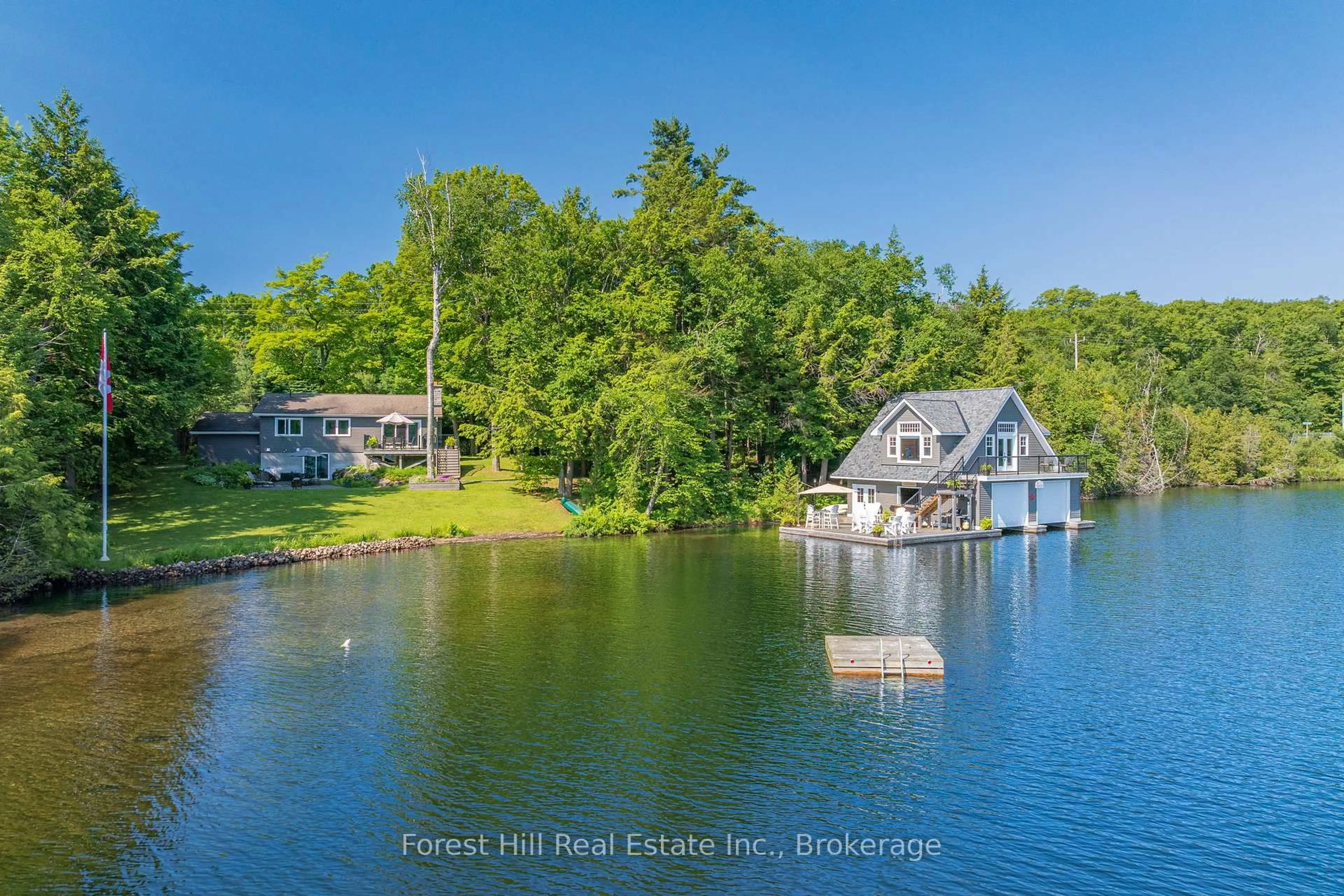 A pic from outside/outdoor area/front of a property/back of a property/a pic from drone, water/lake/river/ocean view for 1800 Lake Joseph Rd, Seguin Ontario P0C 1H0
