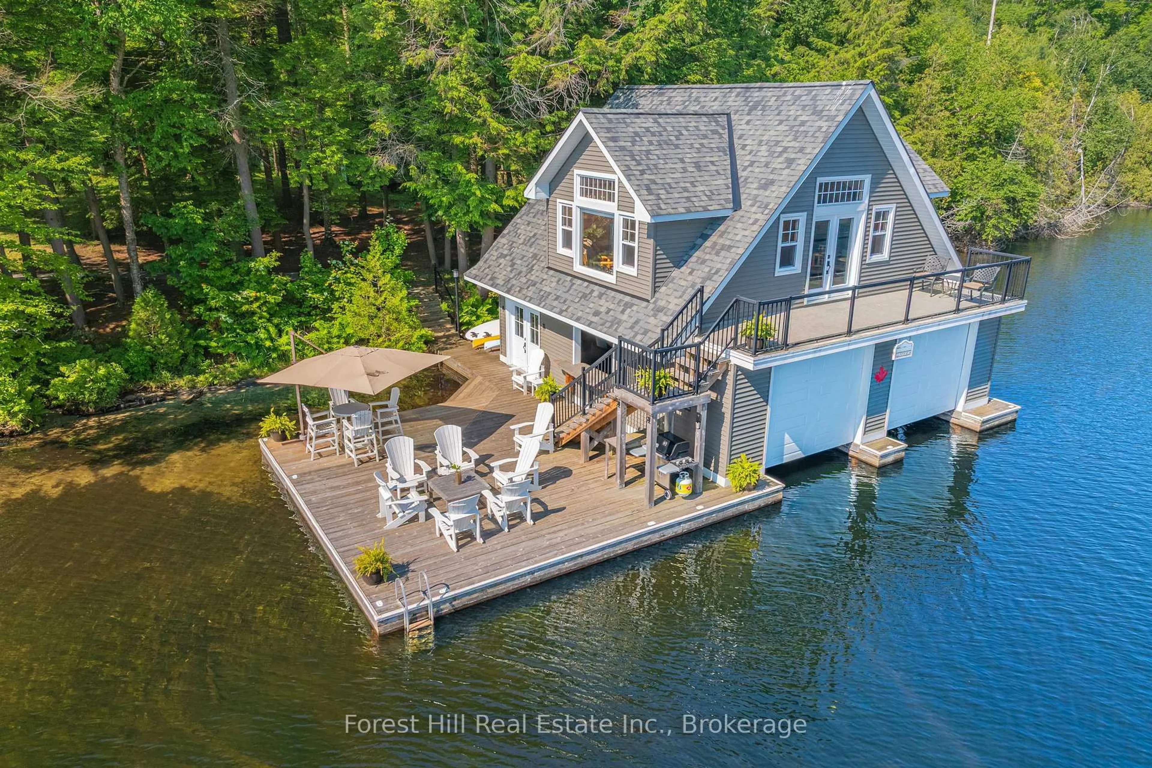 A pic from outside/outdoor area/front of a property/back of a property/a pic from drone, water/lake/river/ocean view for 1800 Lake Joseph Rd, Seguin Ontario P0C 1H0