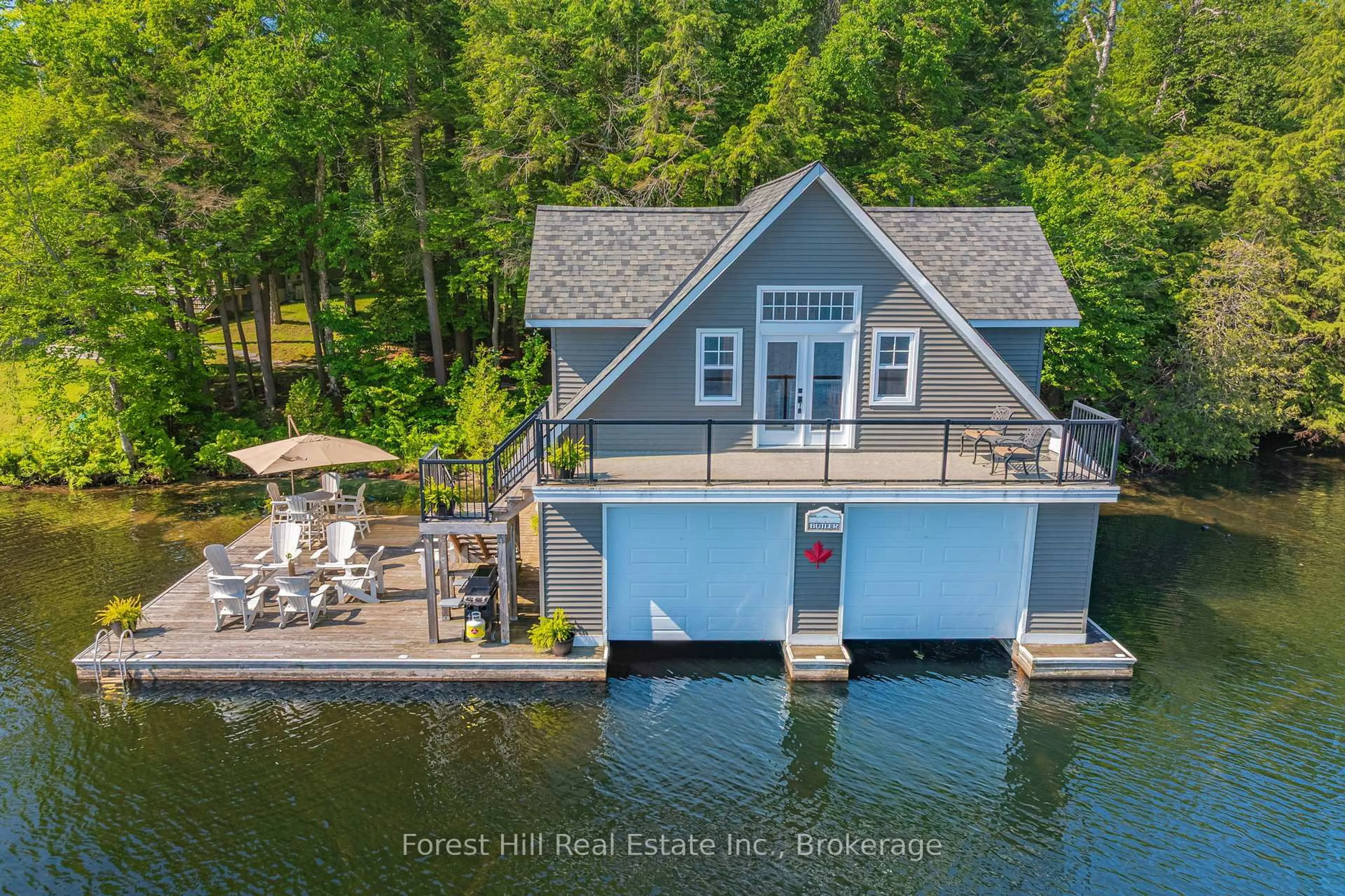 A pic from outside/outdoor area/front of a property/back of a property/a pic from drone, water/lake/river/ocean view for 1800 Lake Joseph Rd, Seguin Ontario P0C 1H0
