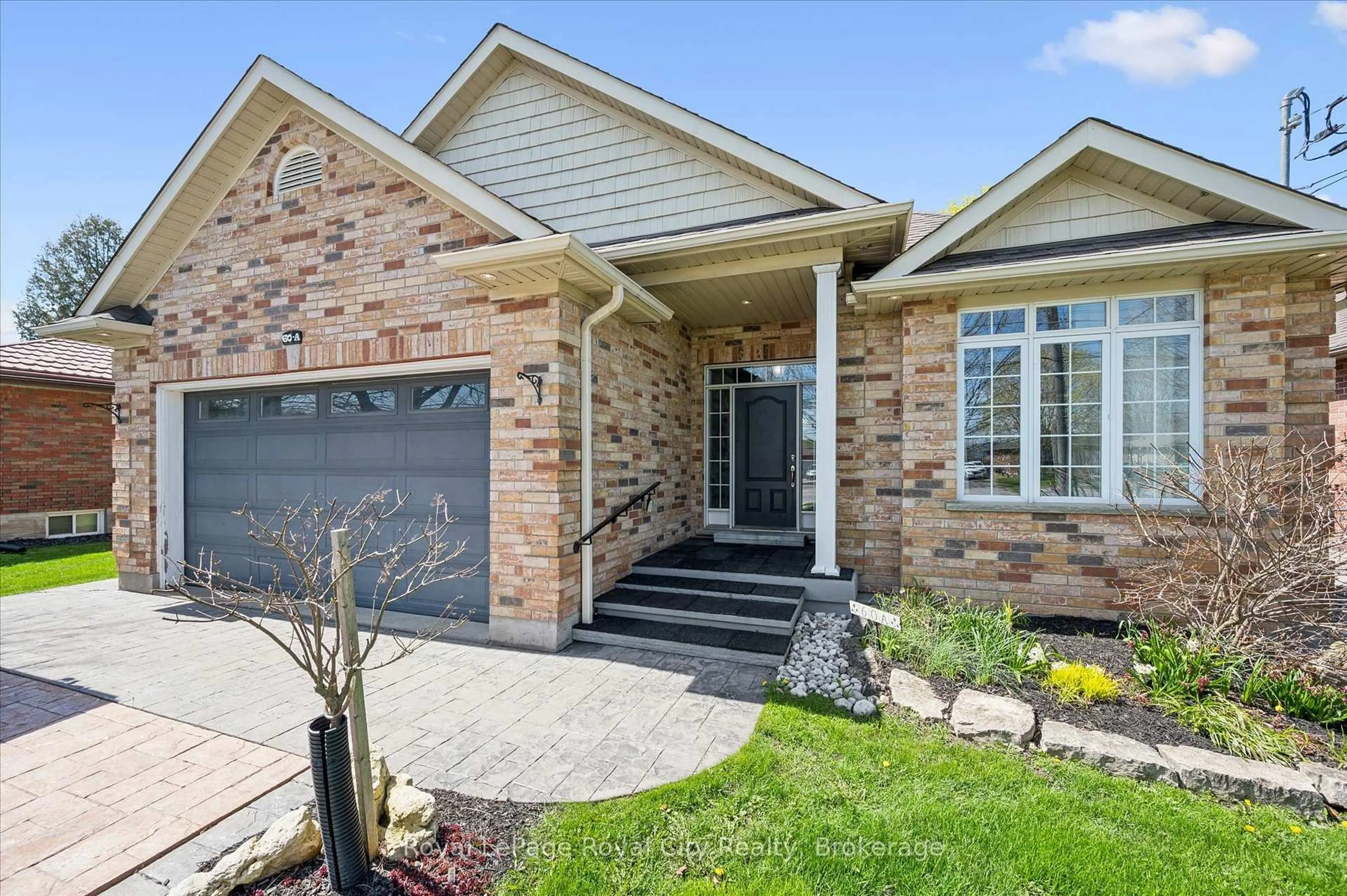 Home with brick exterior material, street for 60A Eastview Rd, Guelph Ontario N1E 1Z6