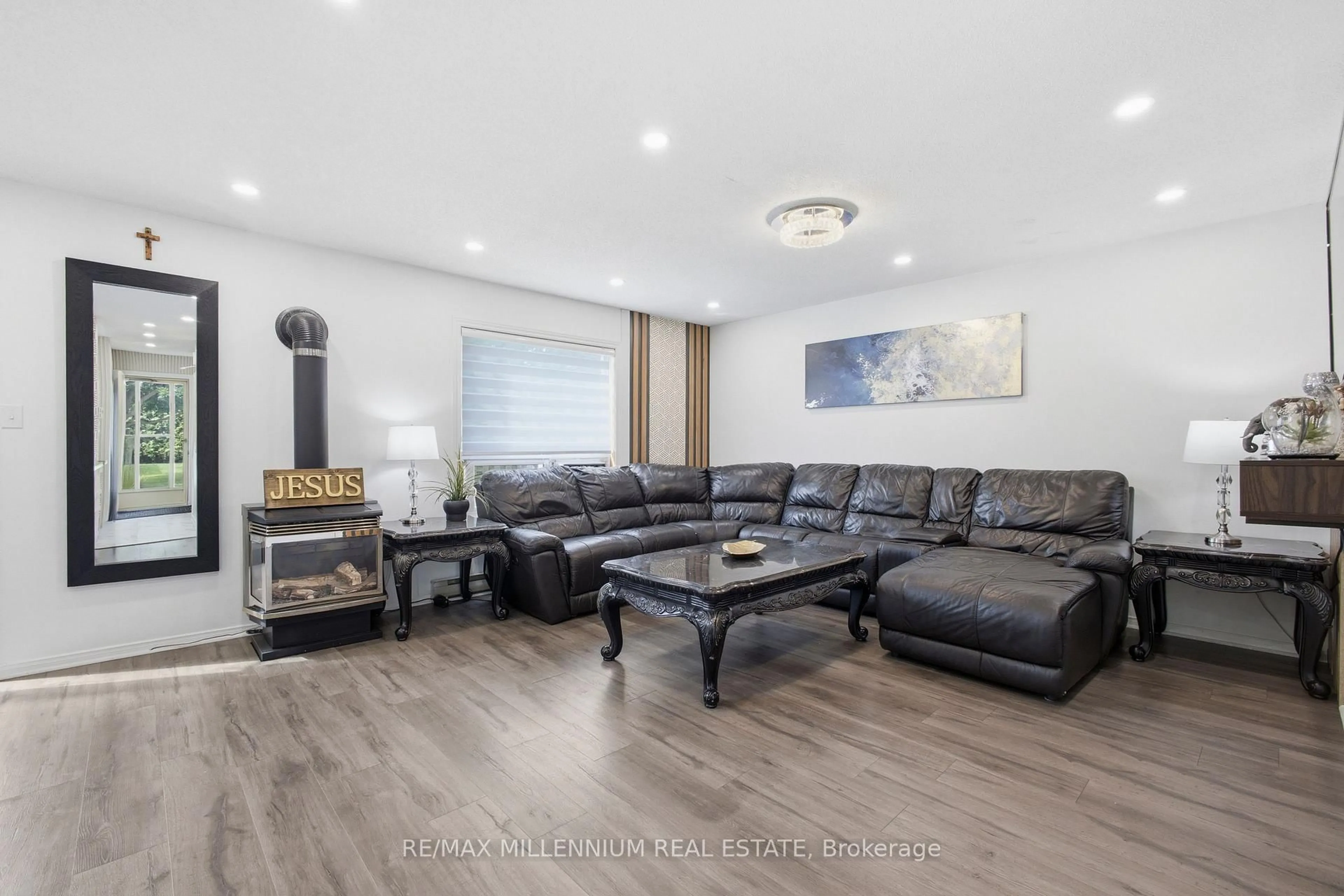 Living room with furniture, wood/laminate floor for 65 Scott St #2, East Luther Grand Valley Ontario L9W 5X3