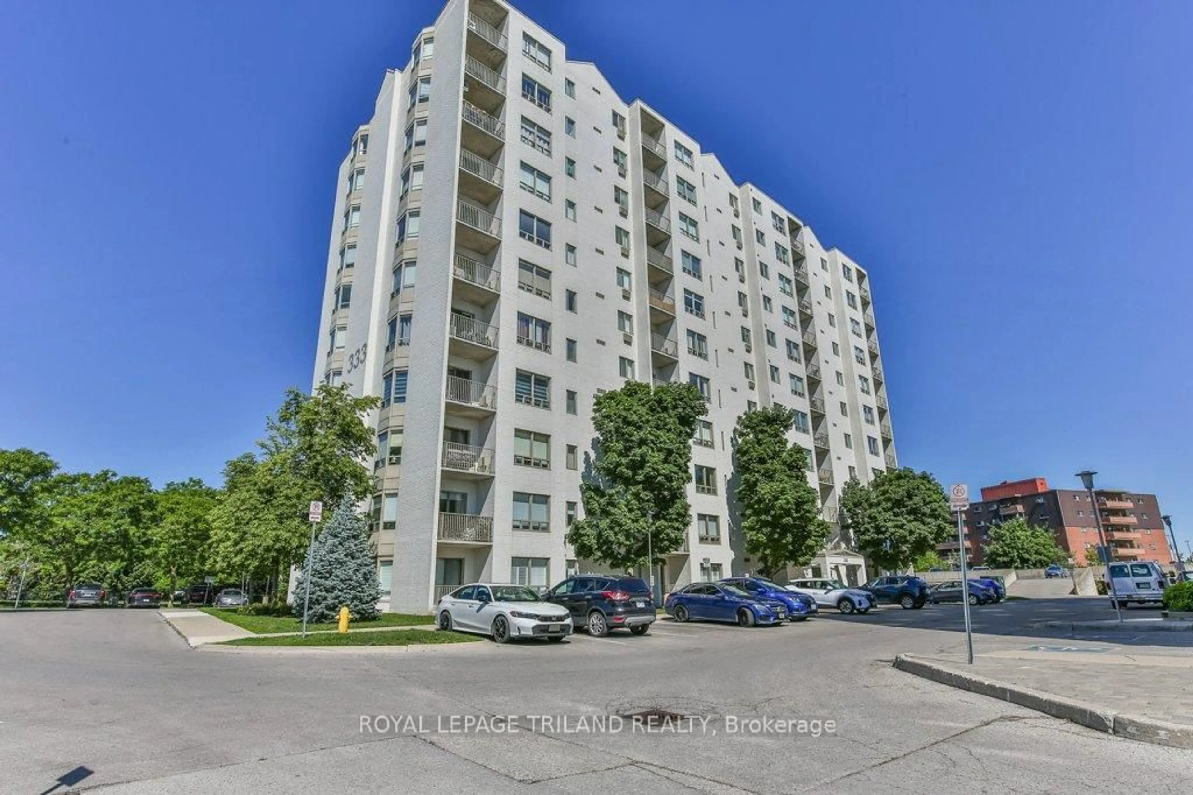 A pic from outside/outdoor area/front of a property/back of a property/a pic from drone, street for 333 Commissioners Rd #405, London South Ontario N6J 4X7