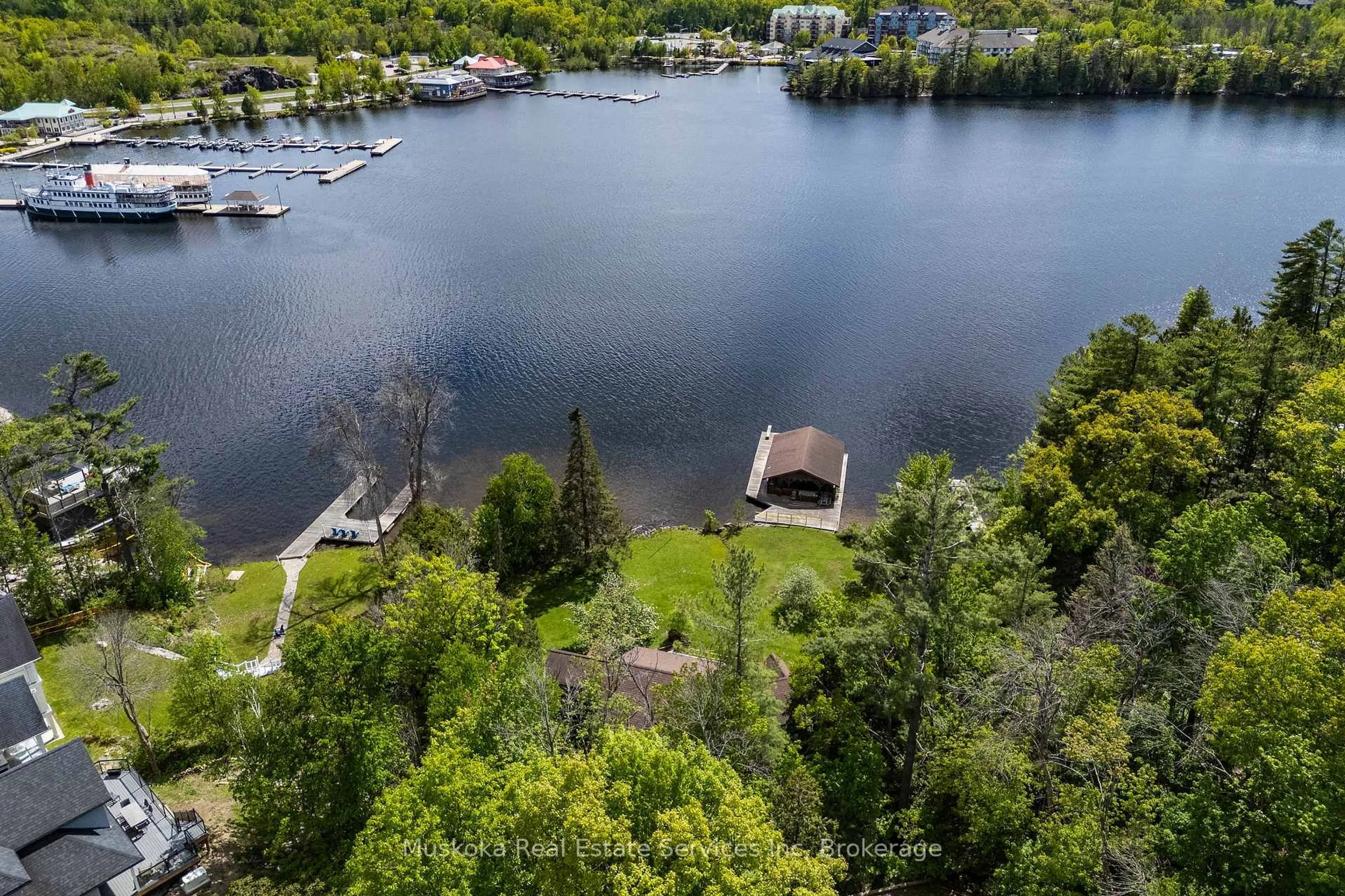 A pic from outside/outdoor area/front of a property/back of a property/a pic from drone, water/lake/river/ocean view for 655 Farquahar St, Gravenhurst Ontario P1P 1E3