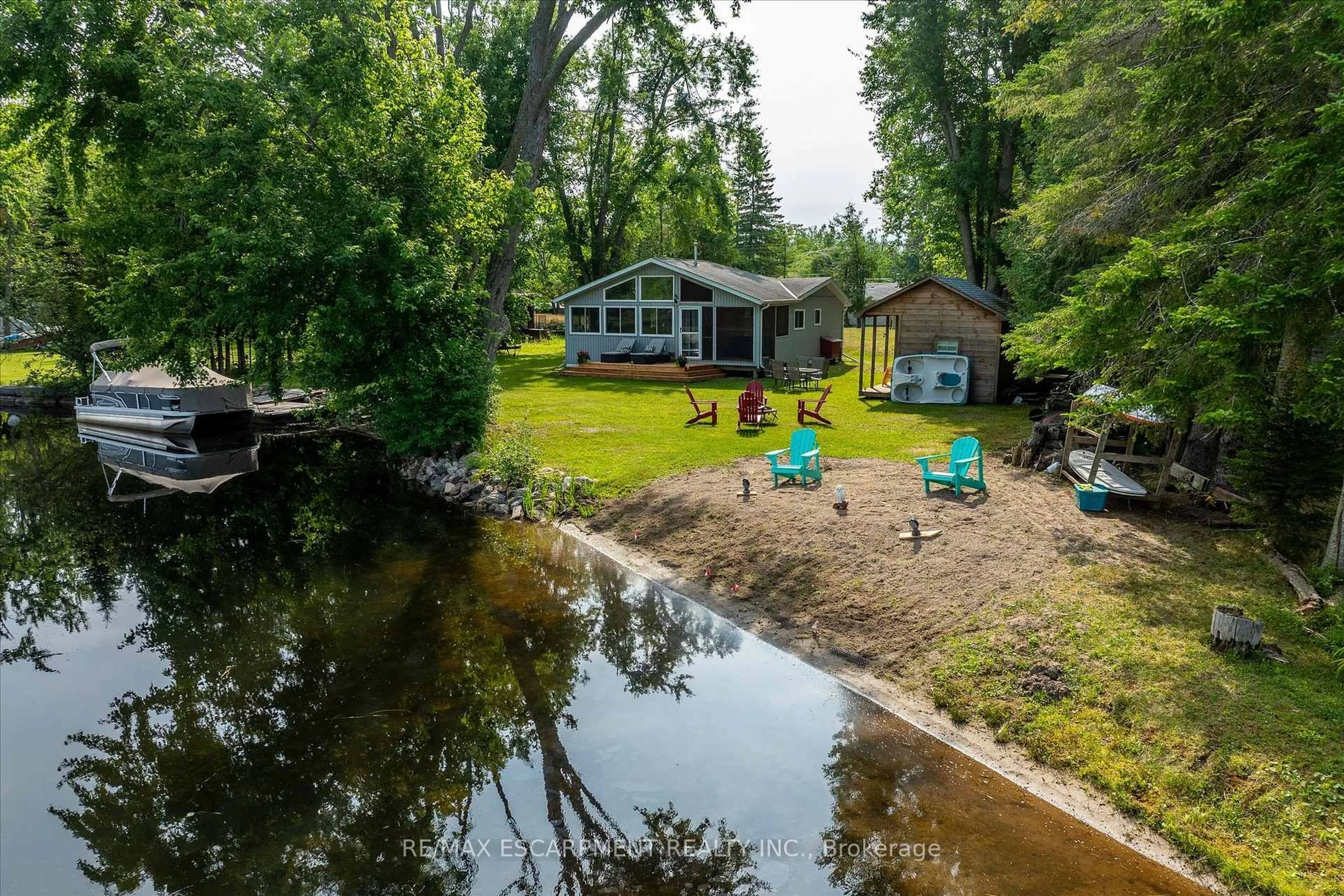A pic from outside/outdoor area/front of a property/back of a property/a pic from drone, water/lake/river/ocean view for 38 FIRE ROUTE 104A, Trent Lakes Ontario K0M 1A0