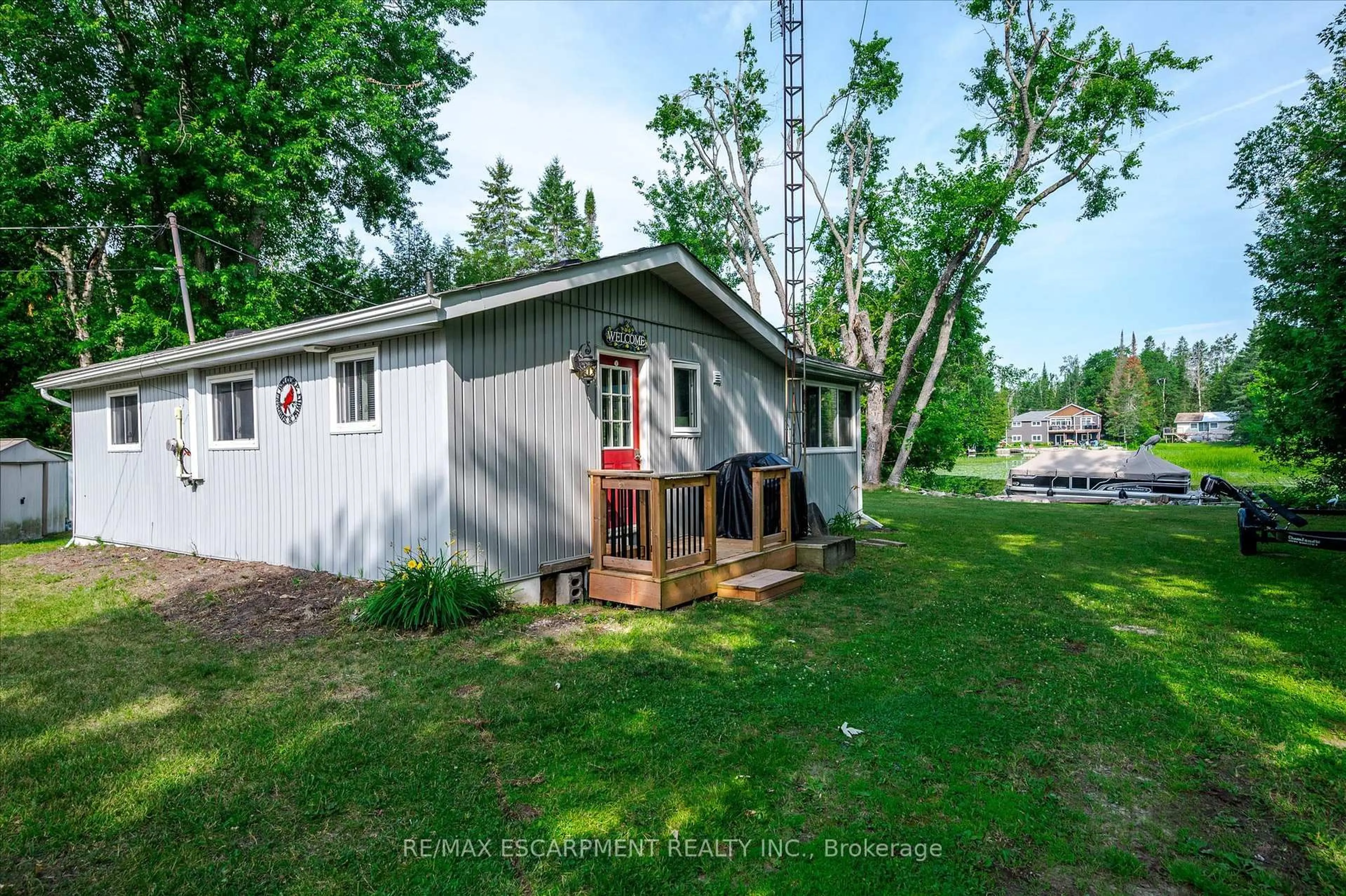 A pic from outside/outdoor area/front of a property/back of a property/a pic from drone, unknown for 38 FIRE ROUTE 104A, Trent Lakes Ontario K0M 1A0