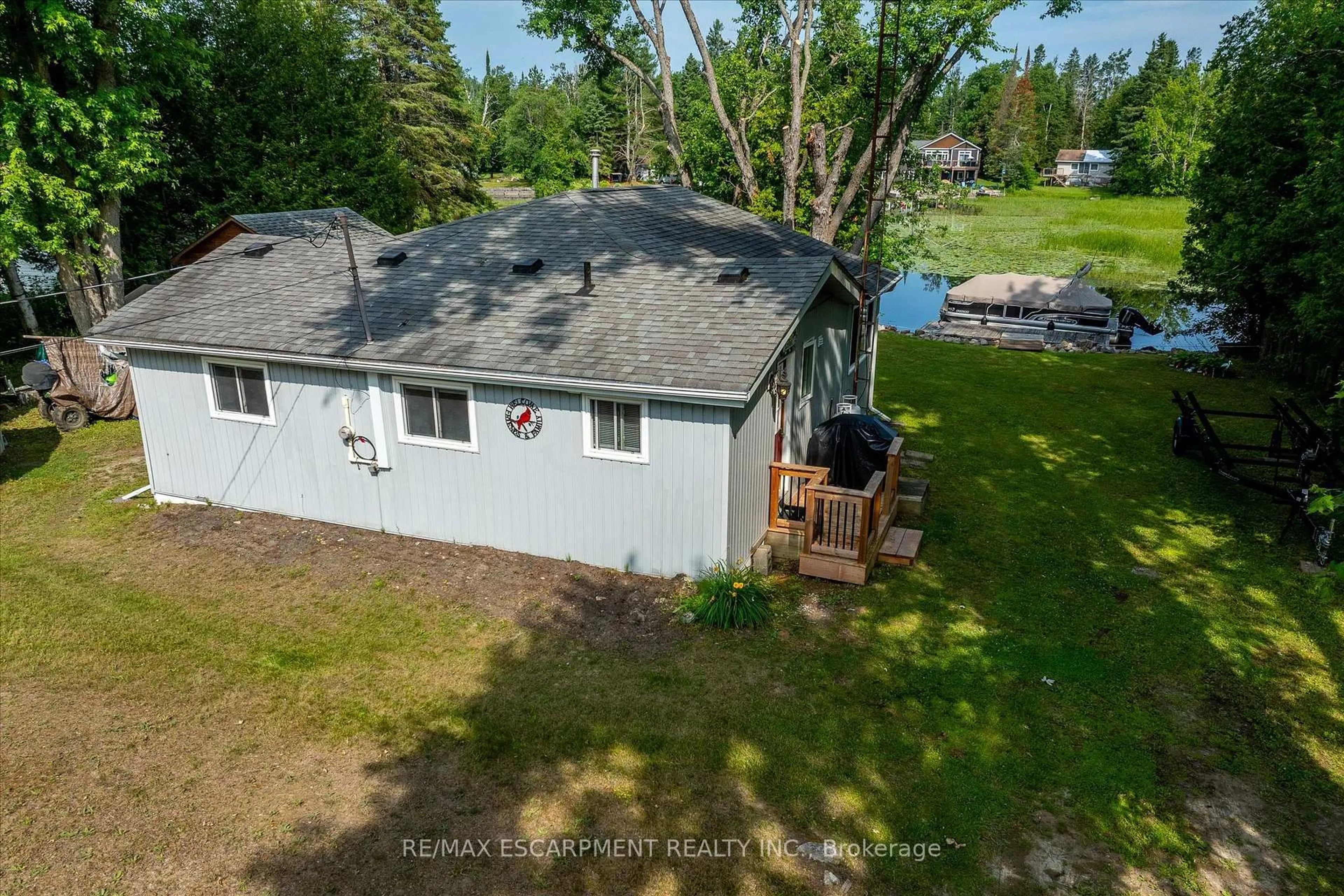 A pic from outside/outdoor area/front of a property/back of a property/a pic from drone, water/lake/river/ocean view for 38 FIRE ROUTE 104A, Trent Lakes Ontario K0M 1A0