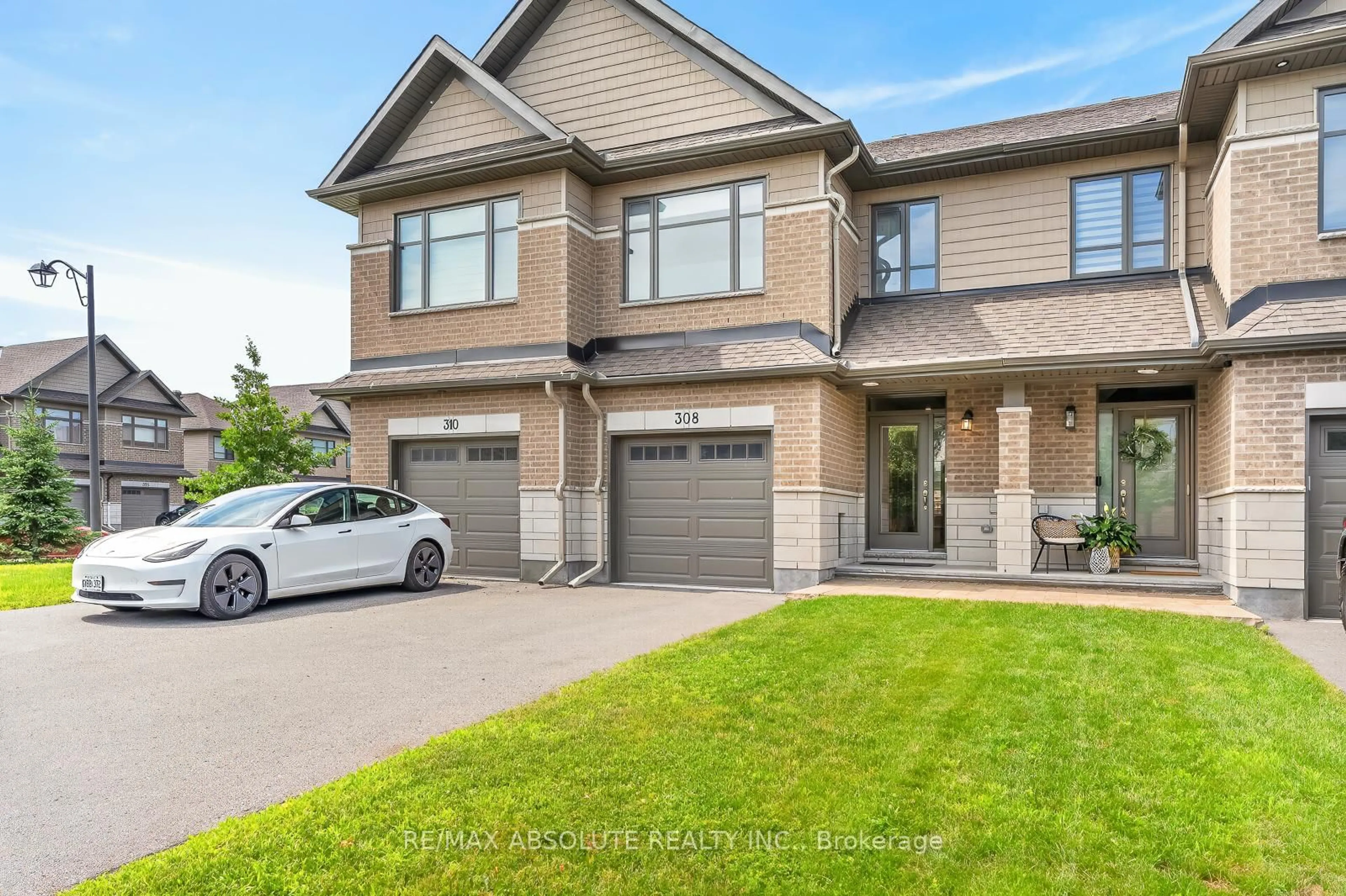 Home with brick exterior material, street for 308 Proud Walk Dr, Stittsville Ontario K2S 2L6