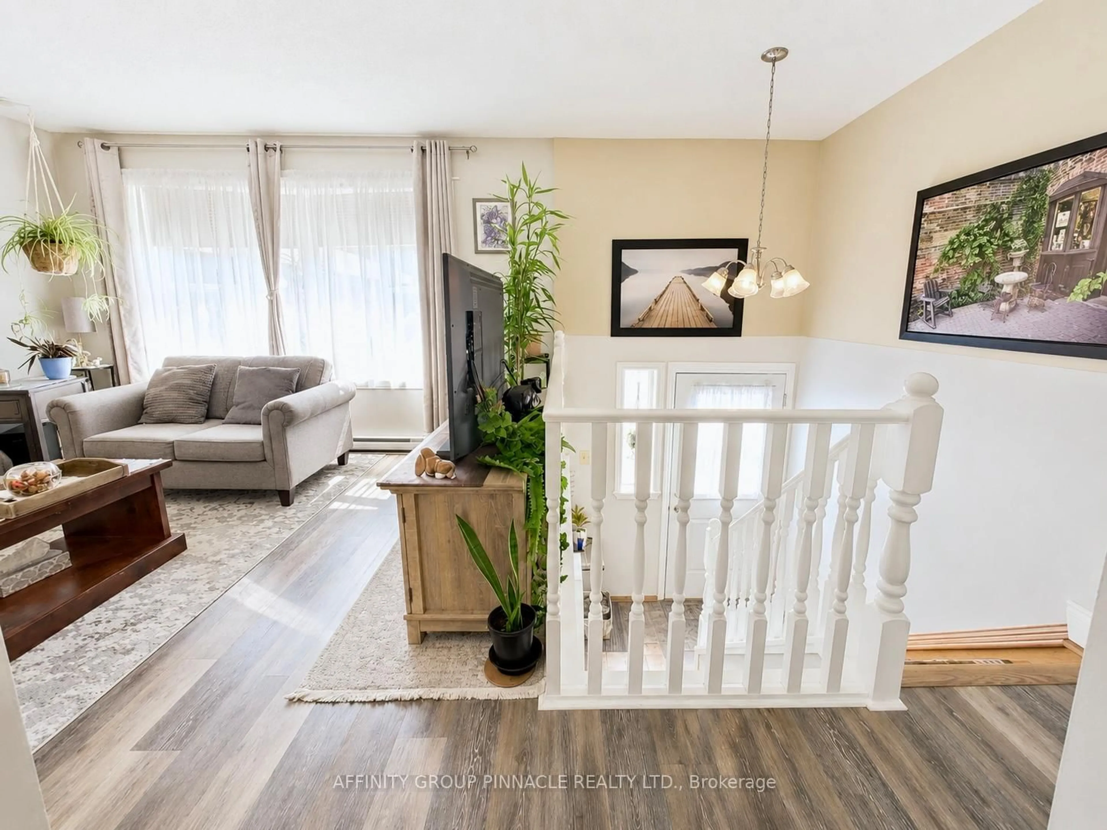 Living room with furniture, wood/laminate floor for 115 Mary St #24, Kawartha Lakes Ontario K9V 2N7