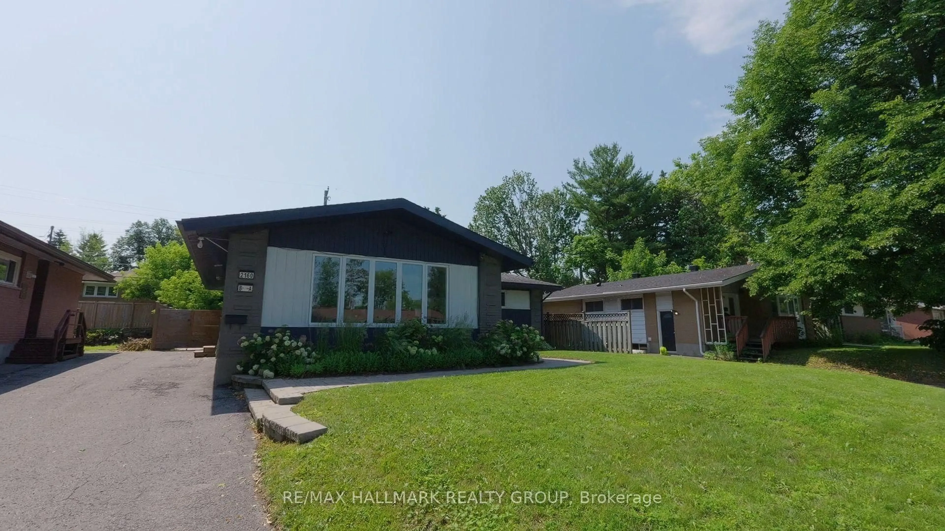 A pic from outside/outdoor area/front of a property/back of a property/a pic from drone, street for 2160 Lambeth Walk, Ottawa Ontario K2C 1G1