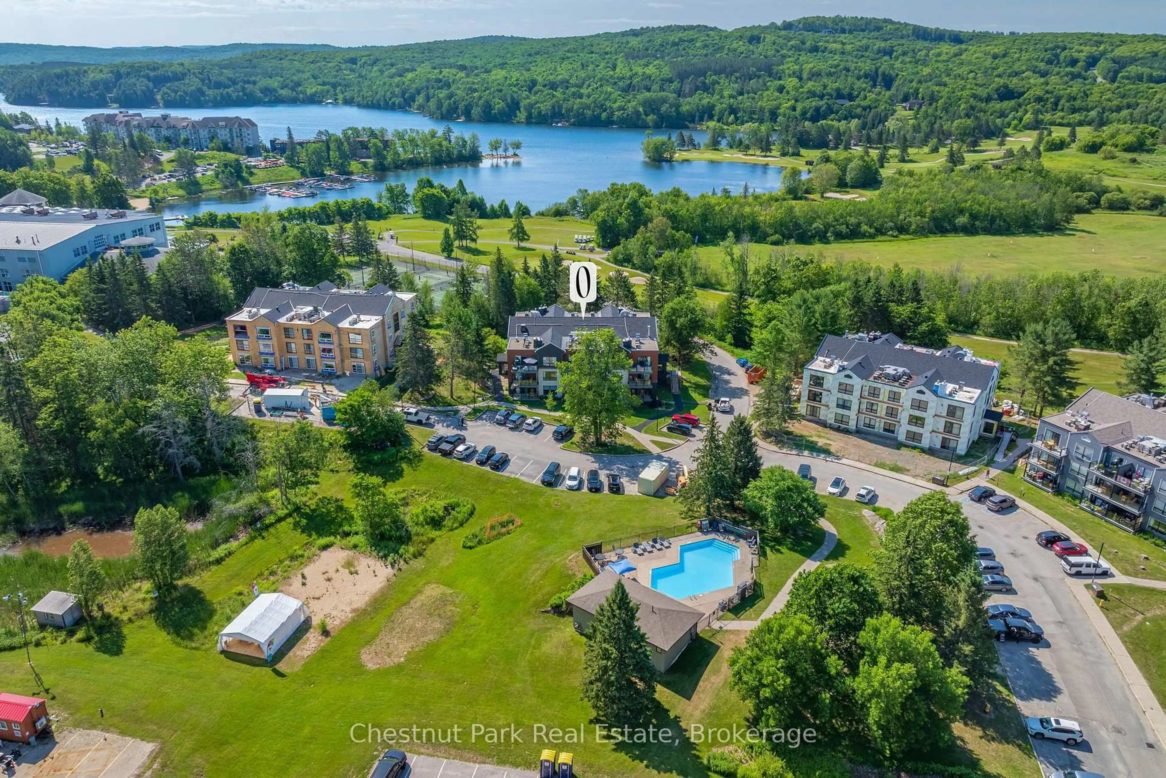 A pic from outside/outdoor area/front of a property/back of a property/a pic from drone, water/lake/river/ocean view for 1235 Deerhurst Summit Dr #52-101, Huntsville Ontario P1H 2E8