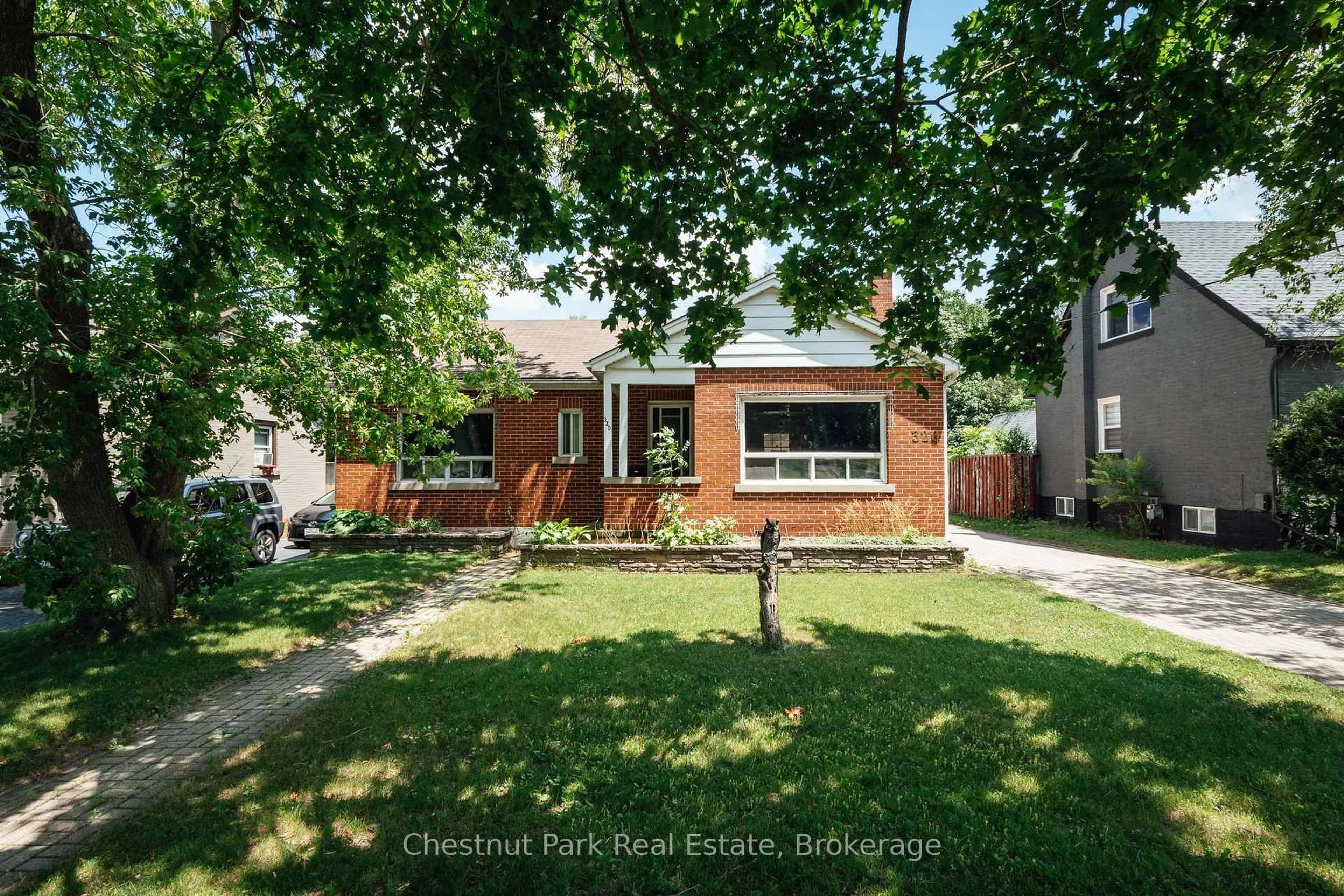 Home with brick exterior material, street for 320 St Leger St, Kitchener Ontario N2H 4M7
