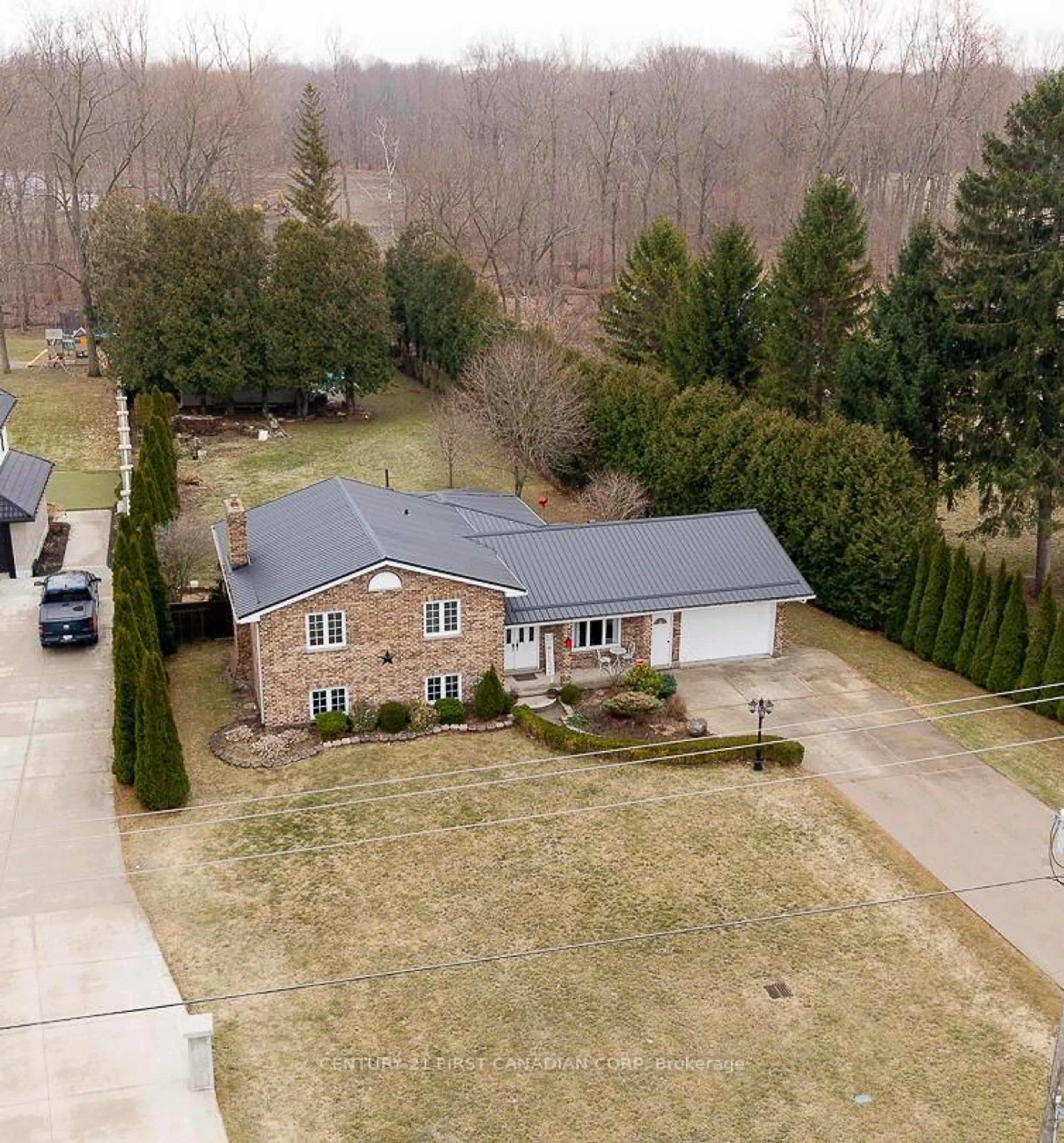 A pic from outside/outdoor area/front of a property/back of a property/a pic from drone, street for 24565 Pioneer Line, West Elgin Ontario N0L 2P0