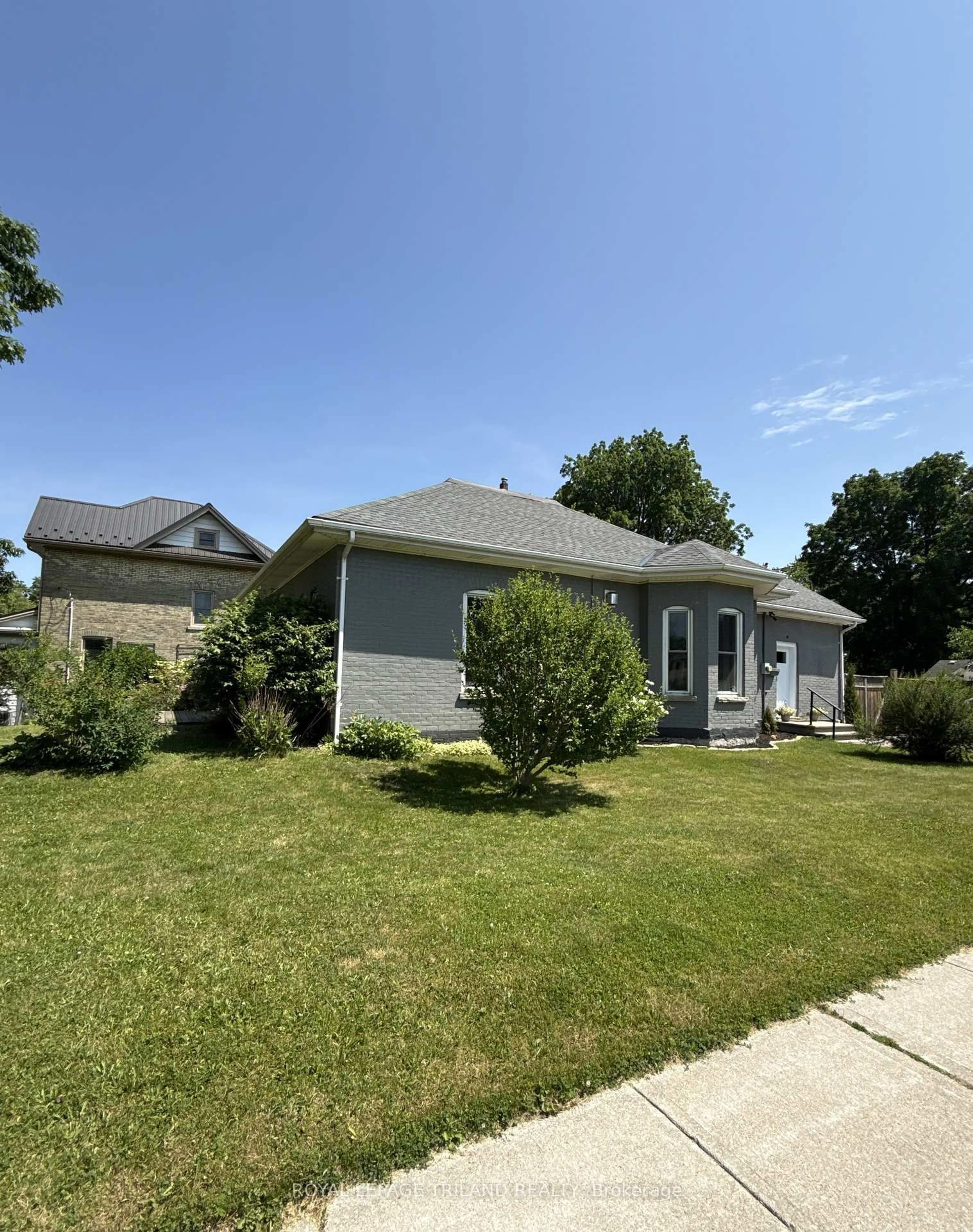 Home with vinyl exterior material, street for 12 East Ave, St. Thomas Ontario N5R 3S8