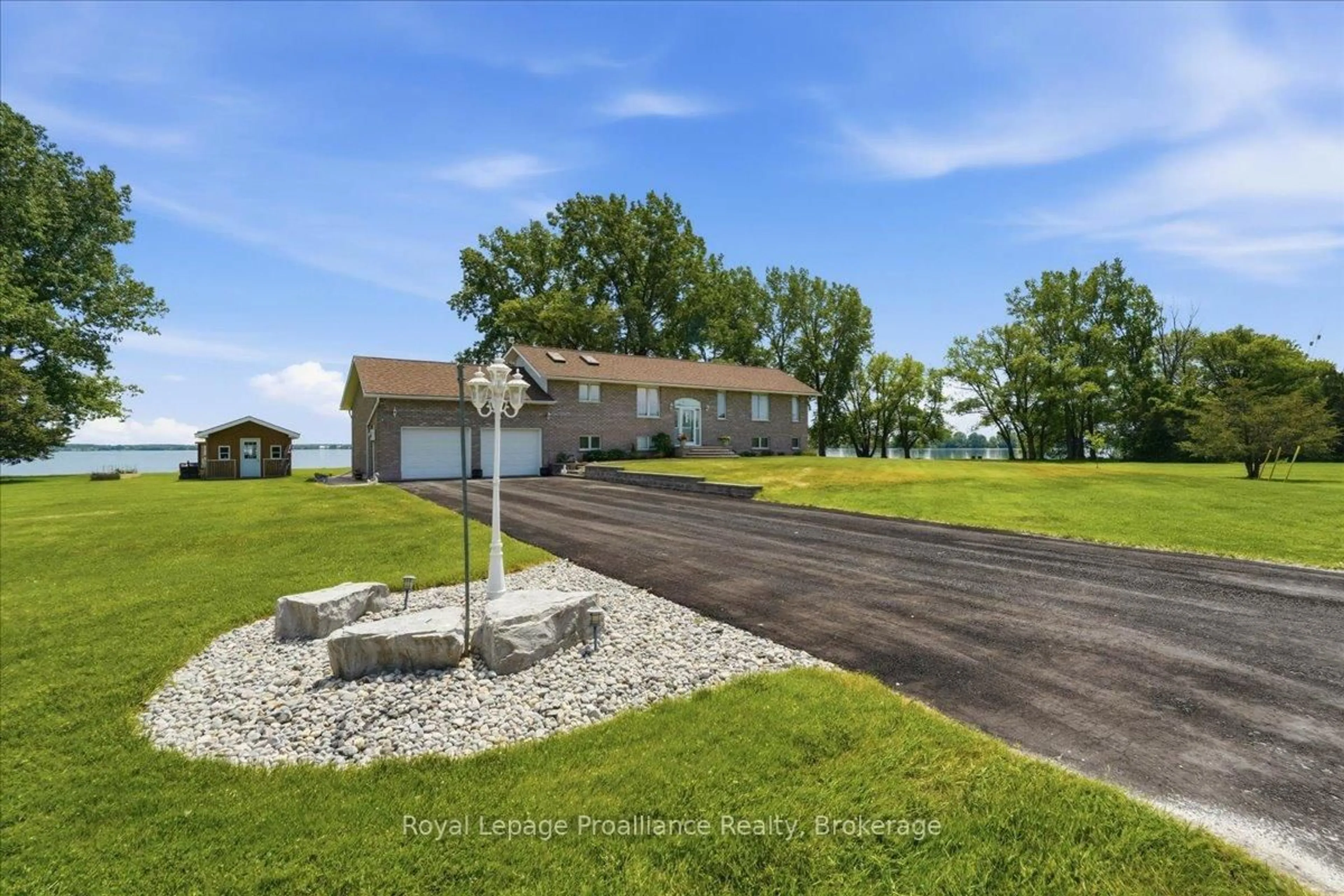 A pic from outside/outdoor area/front of a property/back of a property/a pic from drone, water/lake/river/ocean view for 40 Wallbridge Circ, Prince Edward County Ontario K8N 4Z7