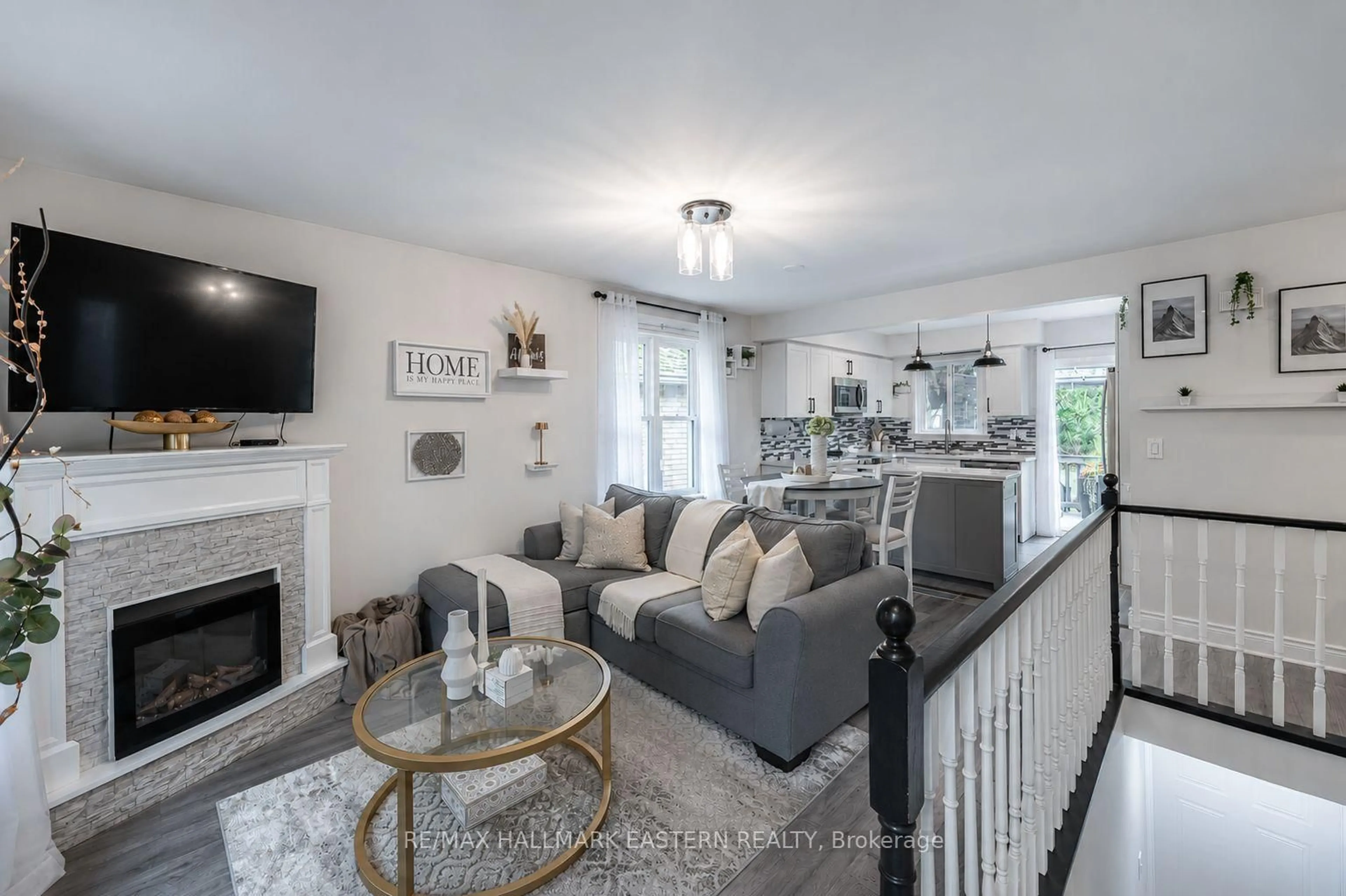 Living room with furniture, ceramic/tile floor for 297 Towerhill Rd, Peterborough Ontario K9H 7N1