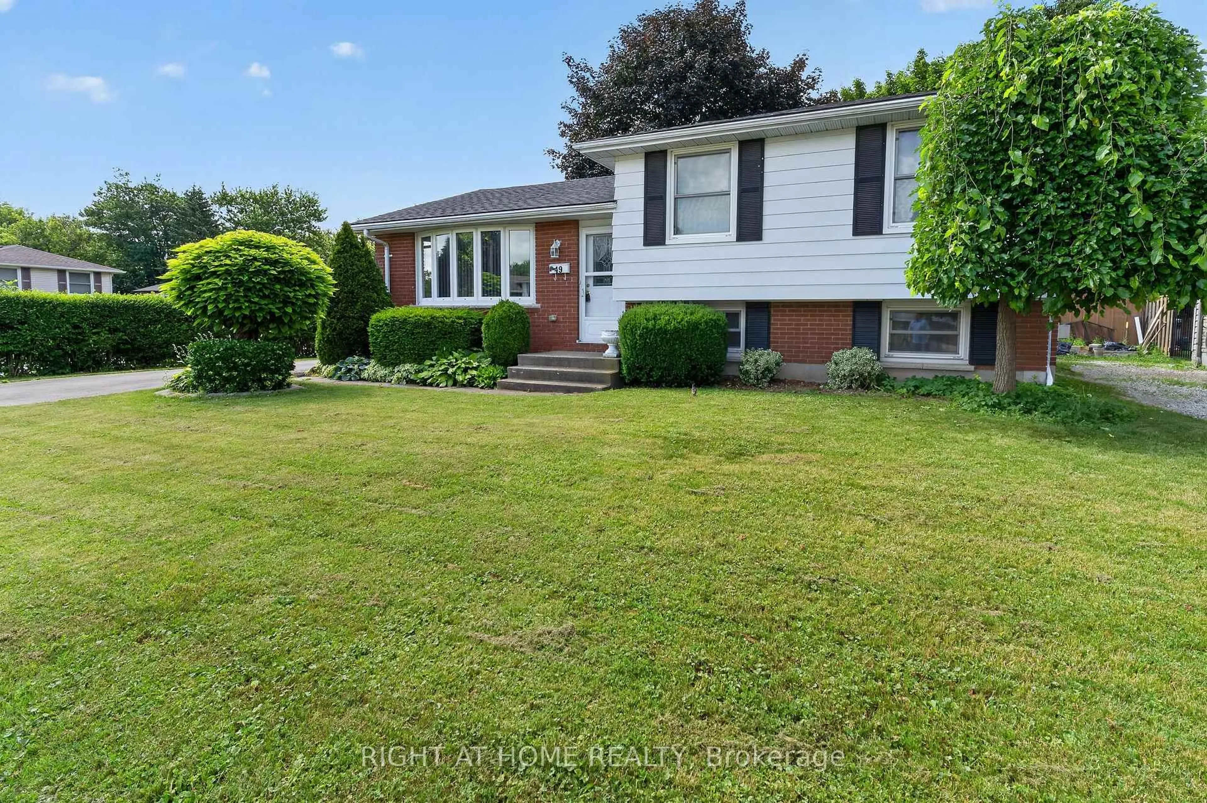 Home with brick exterior material, street for 49 Locke Ave, St. Thomas Ontario N5P 3Y4