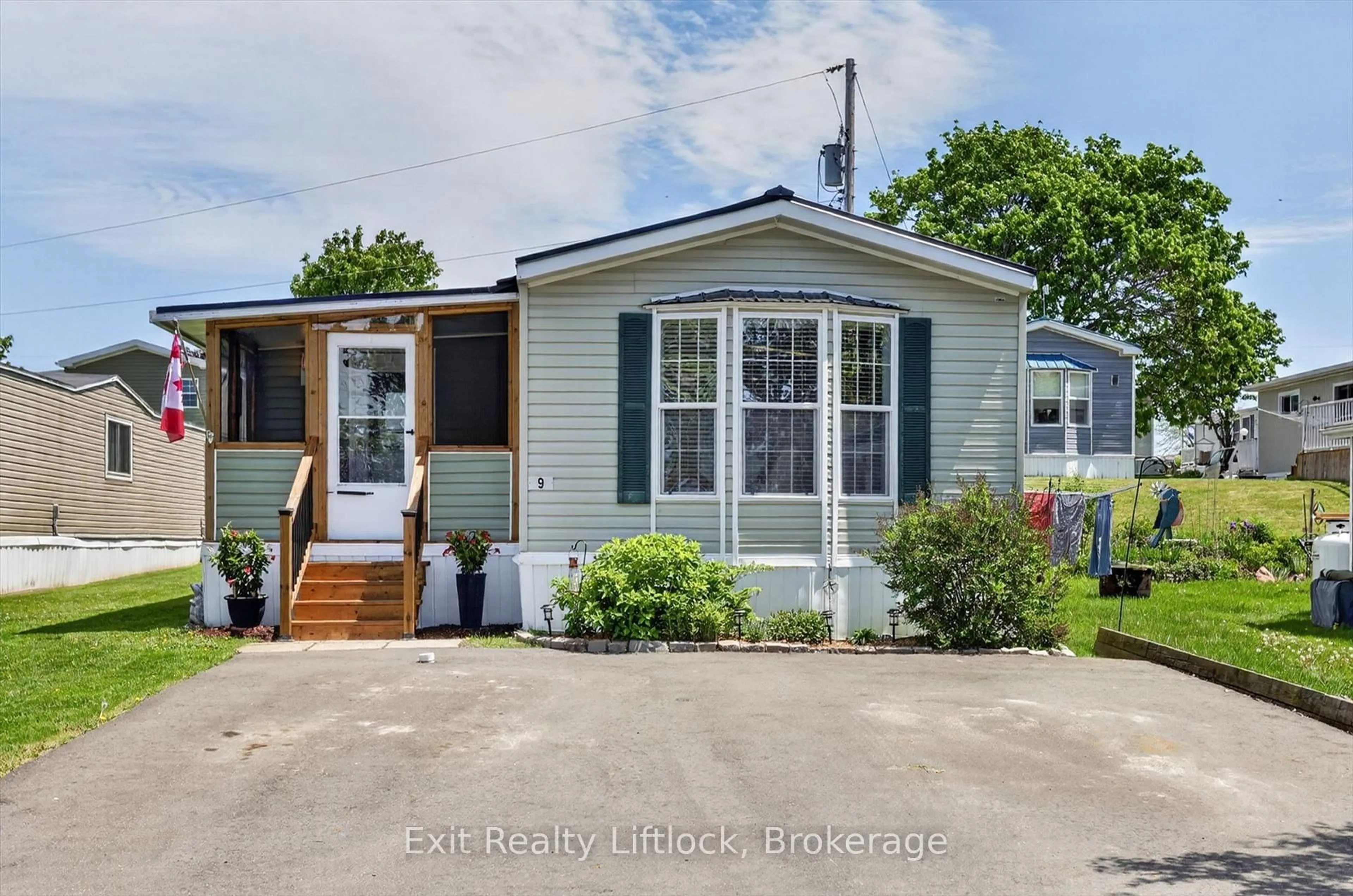 Home with vinyl exterior material, street for 9 Poplar Dr, Otonabee-South Monaghan Ontario K0L 2G0