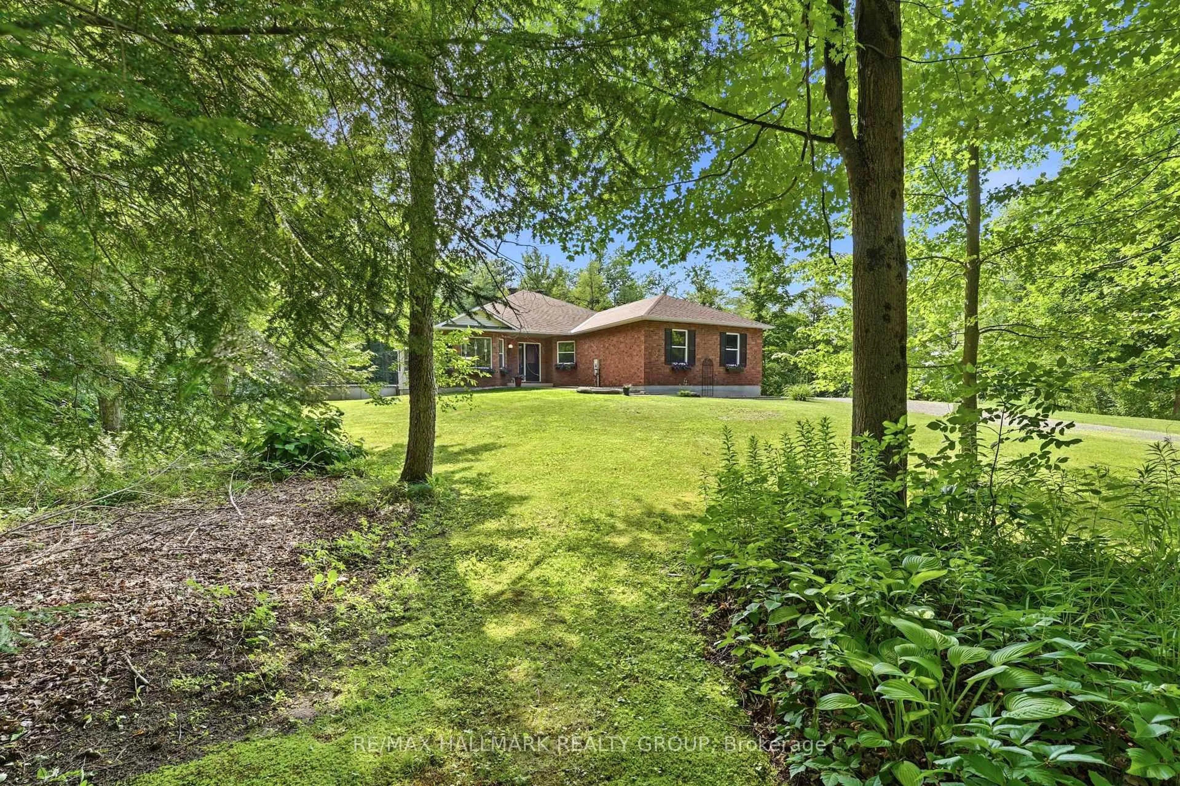 A pic from outside/outdoor area/front of a property/back of a property/a pic from drone, forest/trees view for 18 Josteen Dr, North Grenville Ontario K0G 1J0