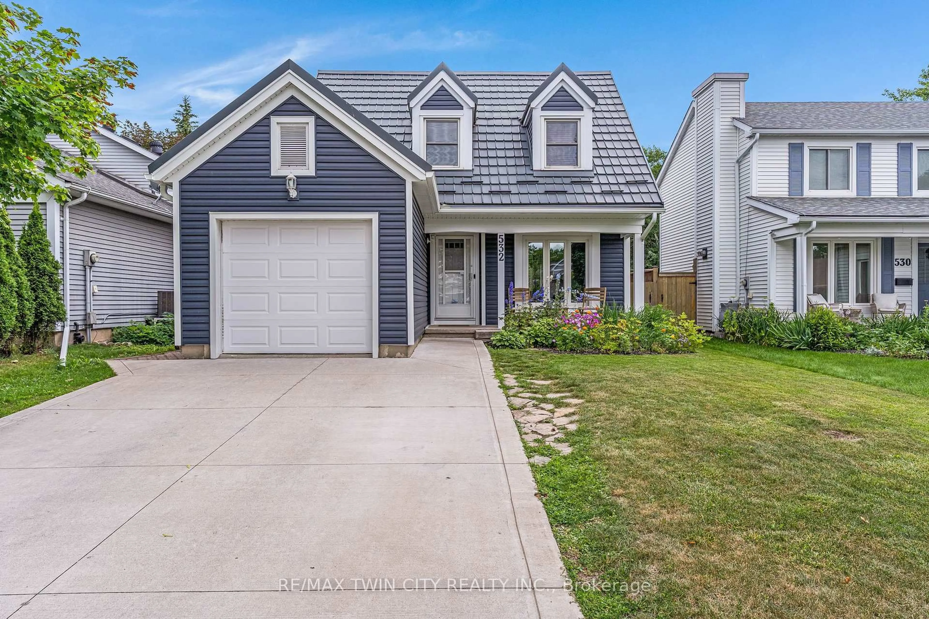 Home with vinyl exterior material, street for 532 Red River Dr, Kitchener Ontario N2T 2B7