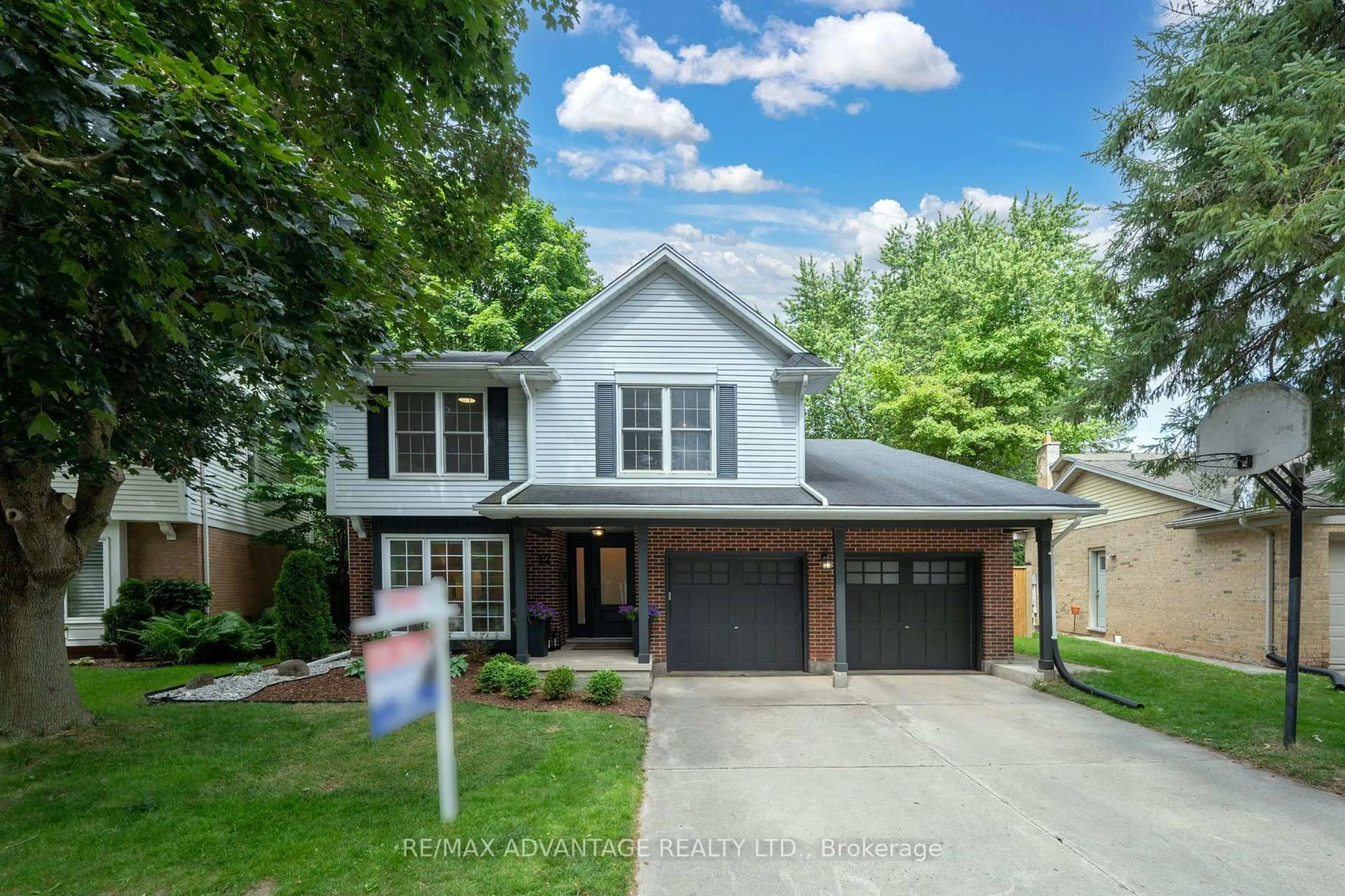 Home with brick exterior material, street for 12 Spencer Cres, London North Ontario N5X 2K6