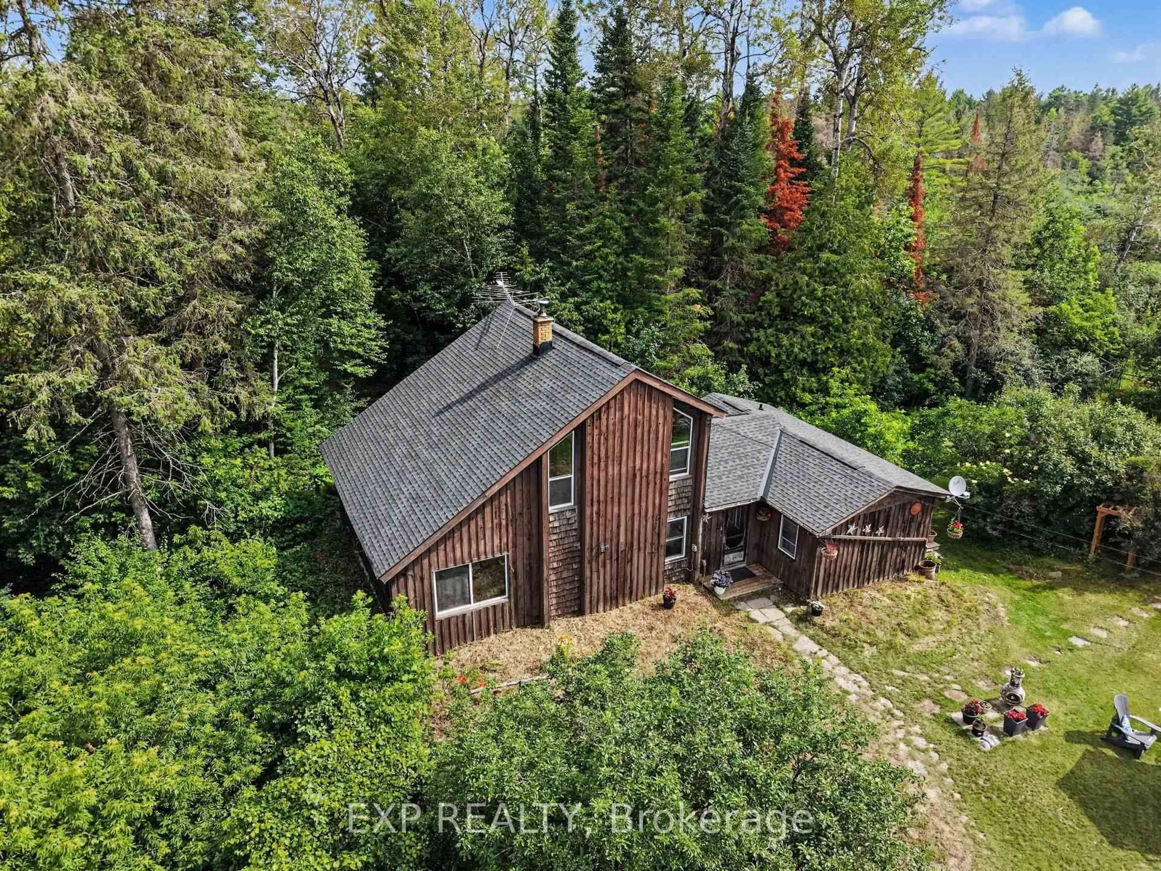 A pic from outside/outdoor area/front of a property/back of a property/a pic from drone, forest/trees view for 1798 Burnt Lands Rd, Carp Ontario K0A 1L0