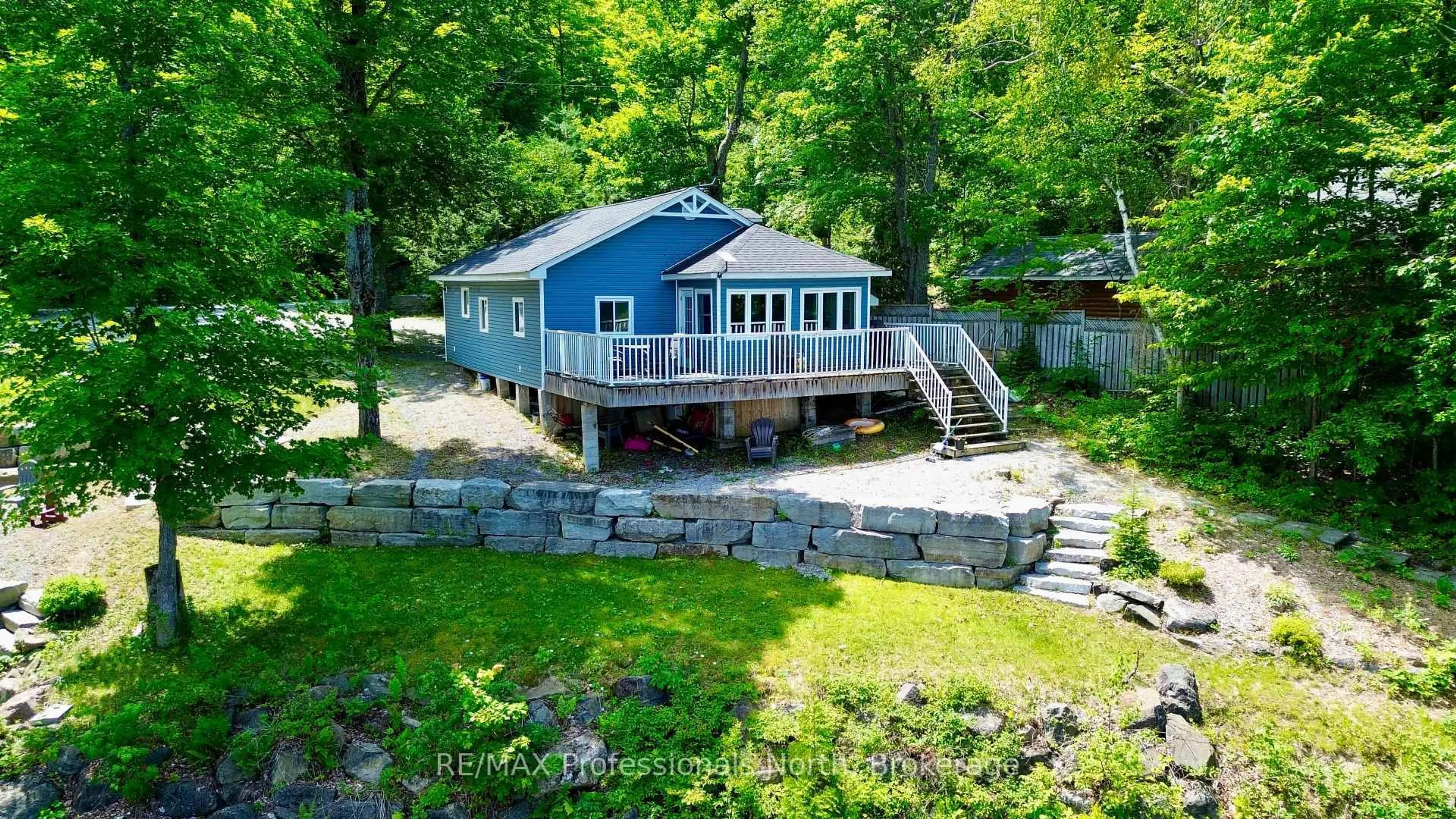 A pic from outside/outdoor area/front of a property/back of a property/a pic from drone, water/lake/river/ocean view for 1129 Comak Cres, Algonquin Highlands Ontario K0M 1J2
