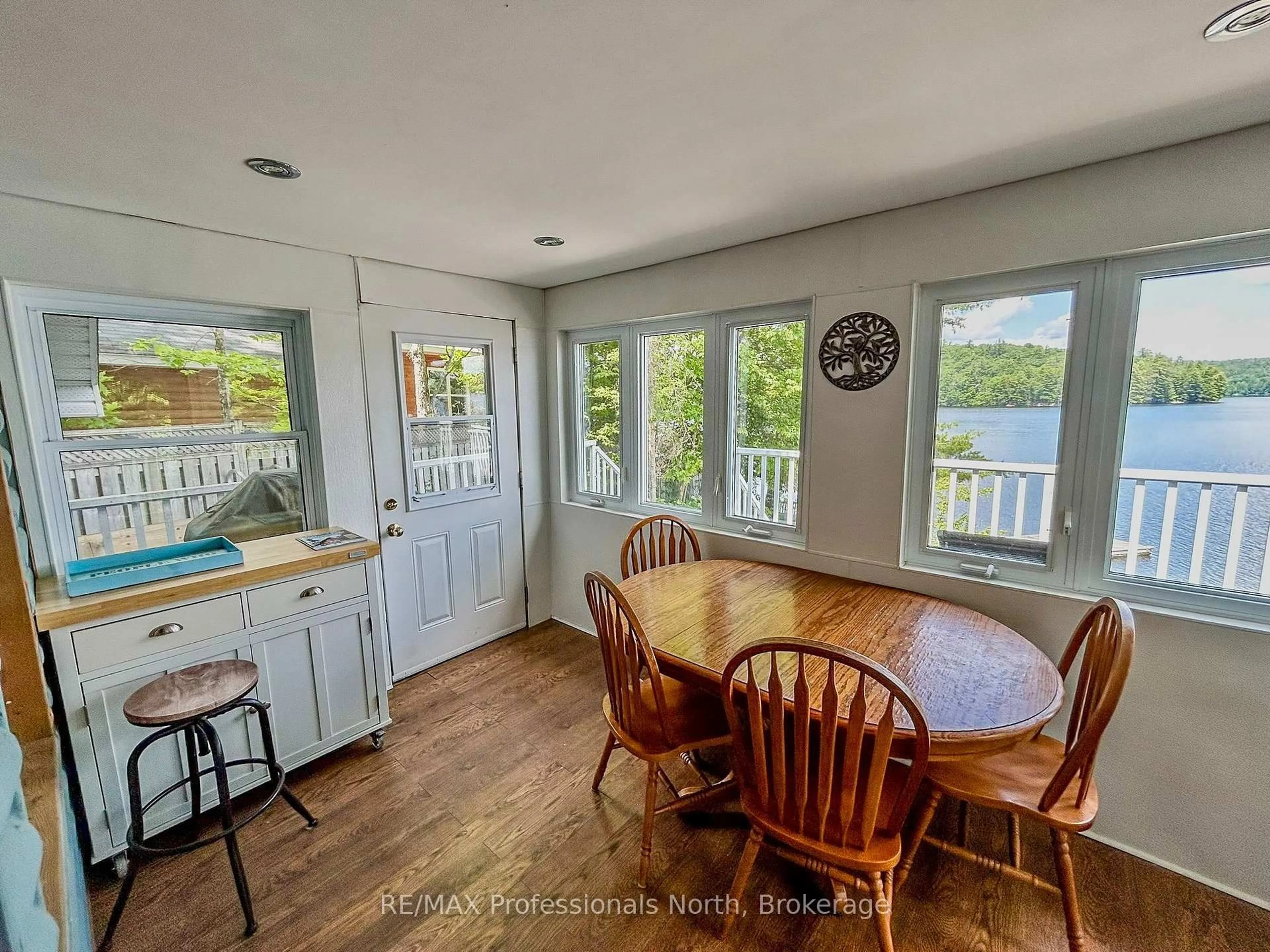 Open concept kitchen, wood/laminate floor for 1129 Comak Cres, Algonquin Highlands Ontario K0M 1J2
