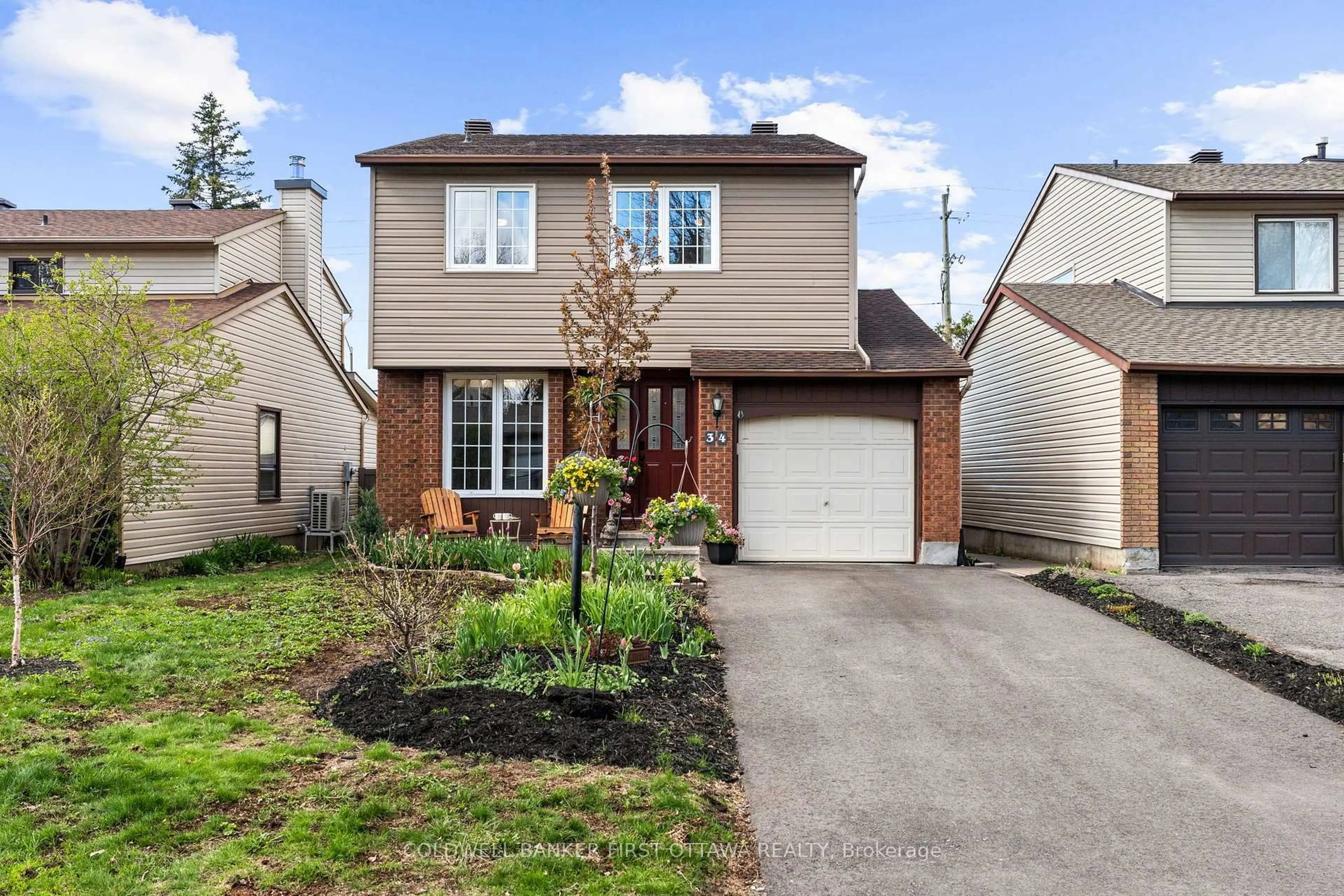 Home with brick exterior material, street for 34 Melville Dr, Ottawa Ontario K2J 2E9