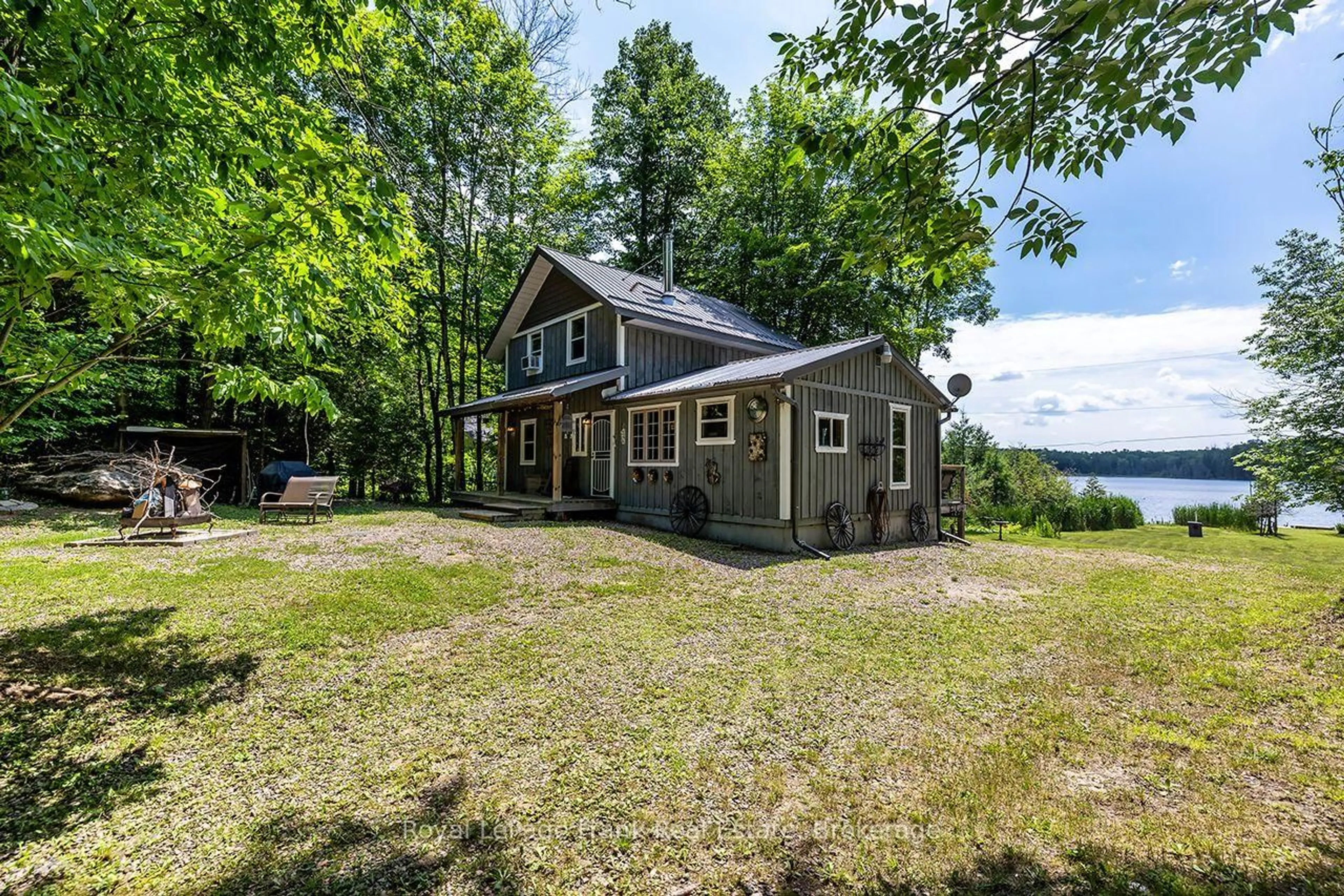 A pic from outside/outdoor area/front of a property/back of a property/a pic from drone, water/lake/river/ocean view for 1014 Riding Tr, Minden Hills Ontario K0M 2L1