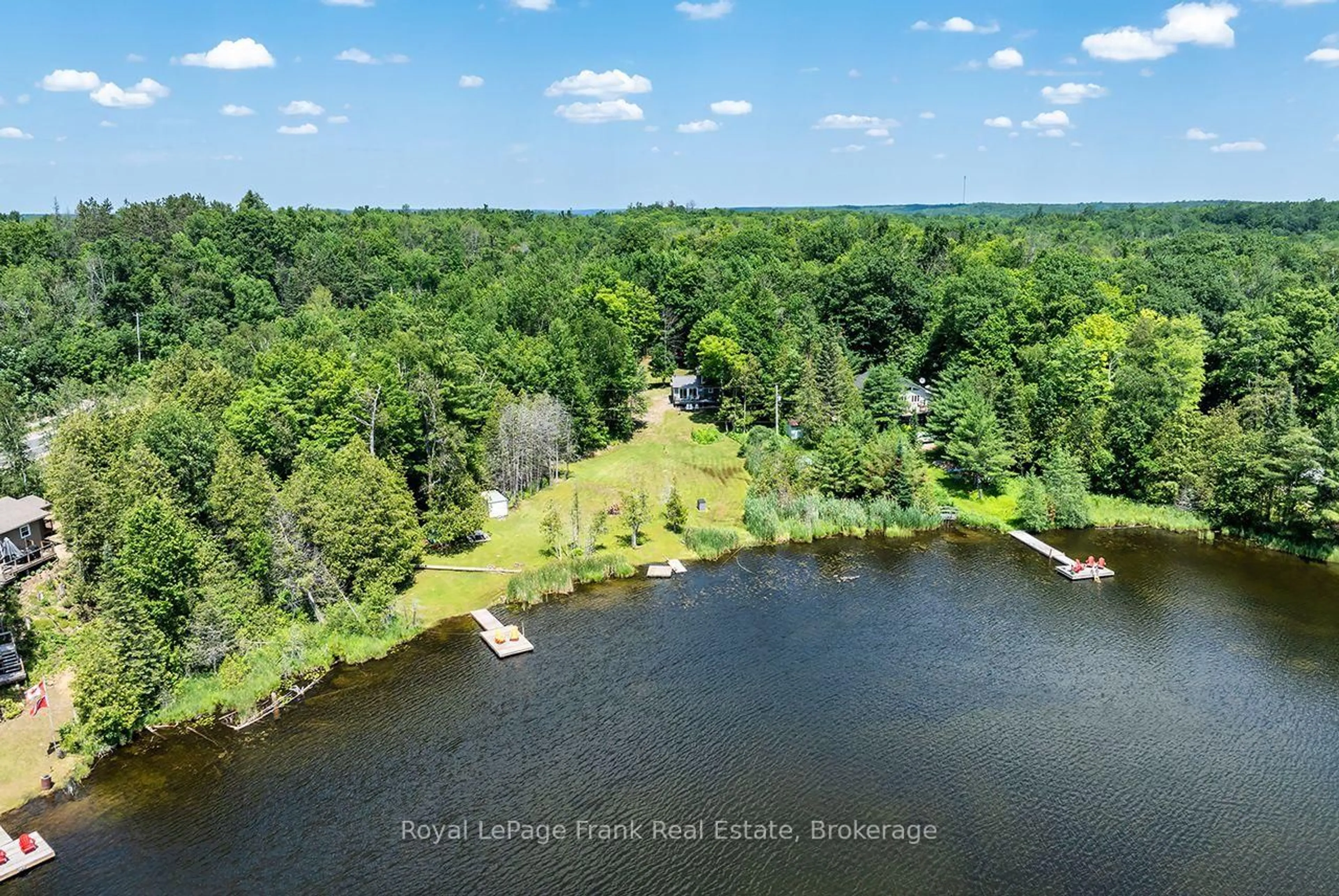 A pic from outside/outdoor area/front of a property/back of a property/a pic from drone, water/lake/river/ocean view for 1014 Riding Tr, Minden Hills Ontario K0M 2L1