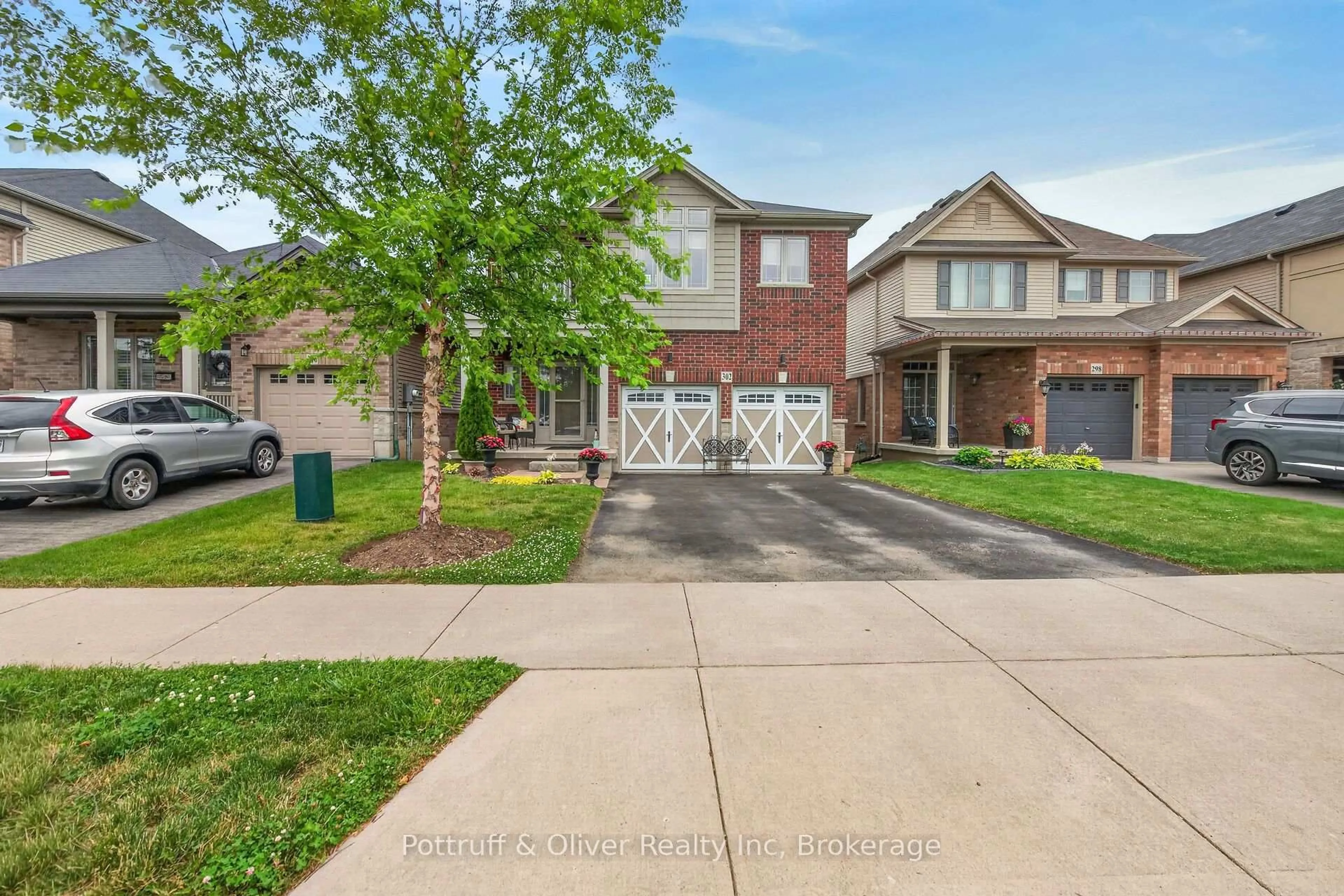 Home with brick exterior material, street for 302 Festival Way, Hamilton Ontario L0R 1C0